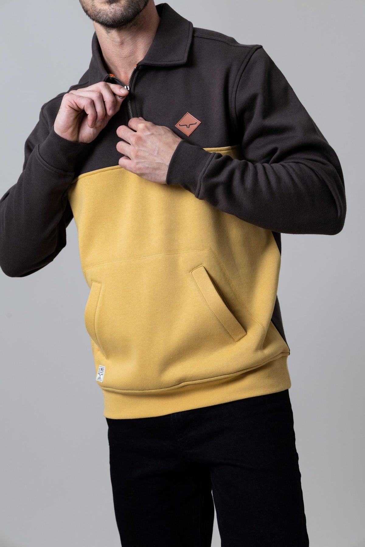Kimes Ranch Diamond Head QZ Sweatshirt in Brown And Mustard with a quarter zip, front kangaroo pocket, and logo patch