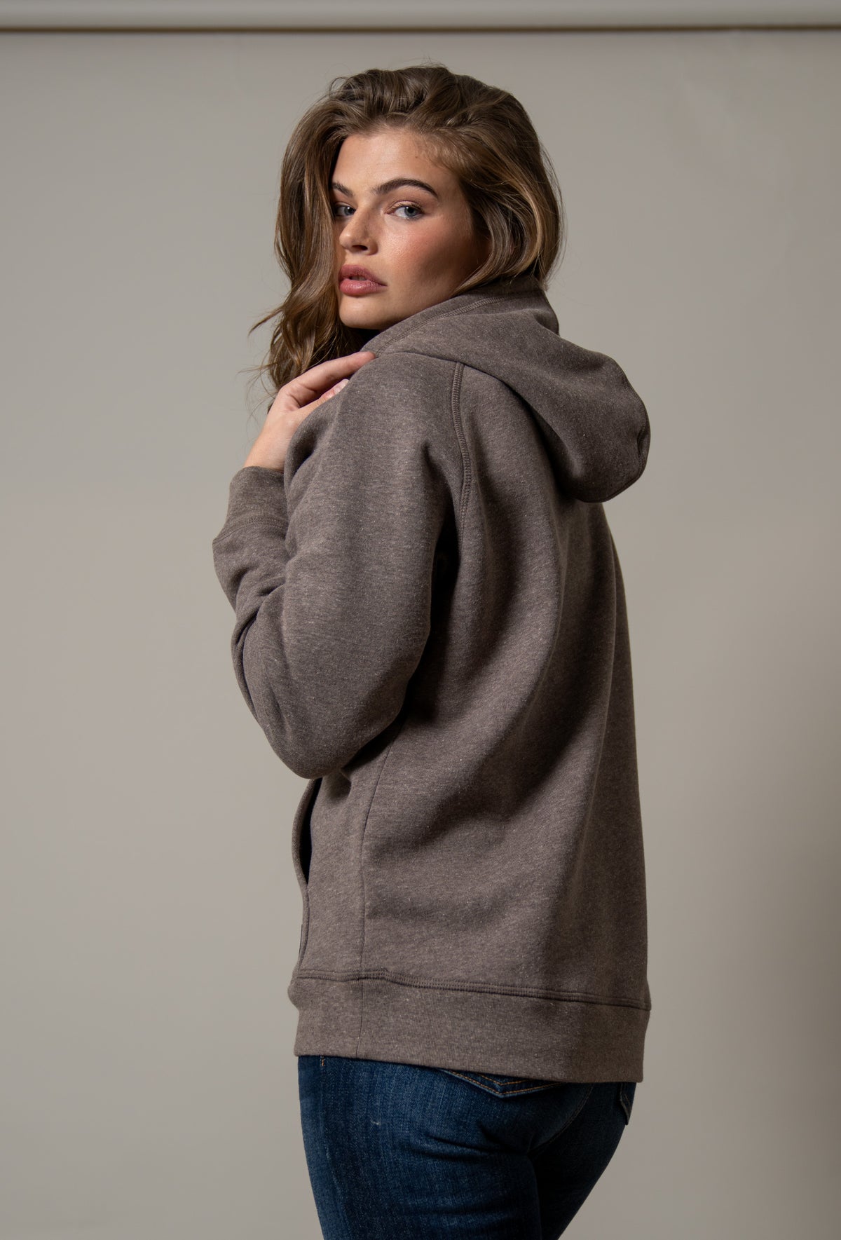 Kimes Ranch Ladies Outlier Hoodie in Dark Brown, side view, with a hood and long sleeves
