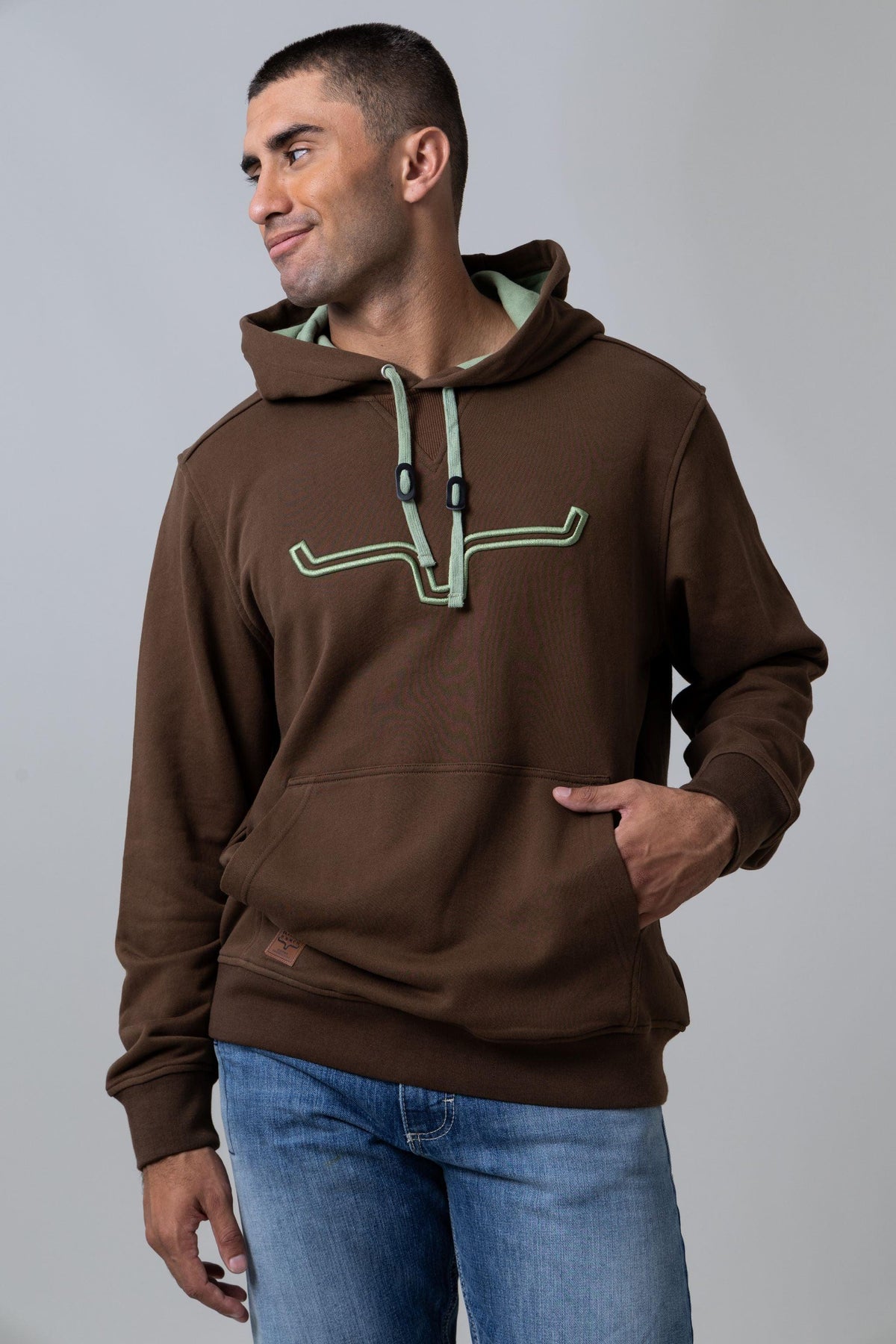 Kimes Ranch Fast Talker Hoodie in Dark Brown with sage green contrast drawstrings and embroidered logo