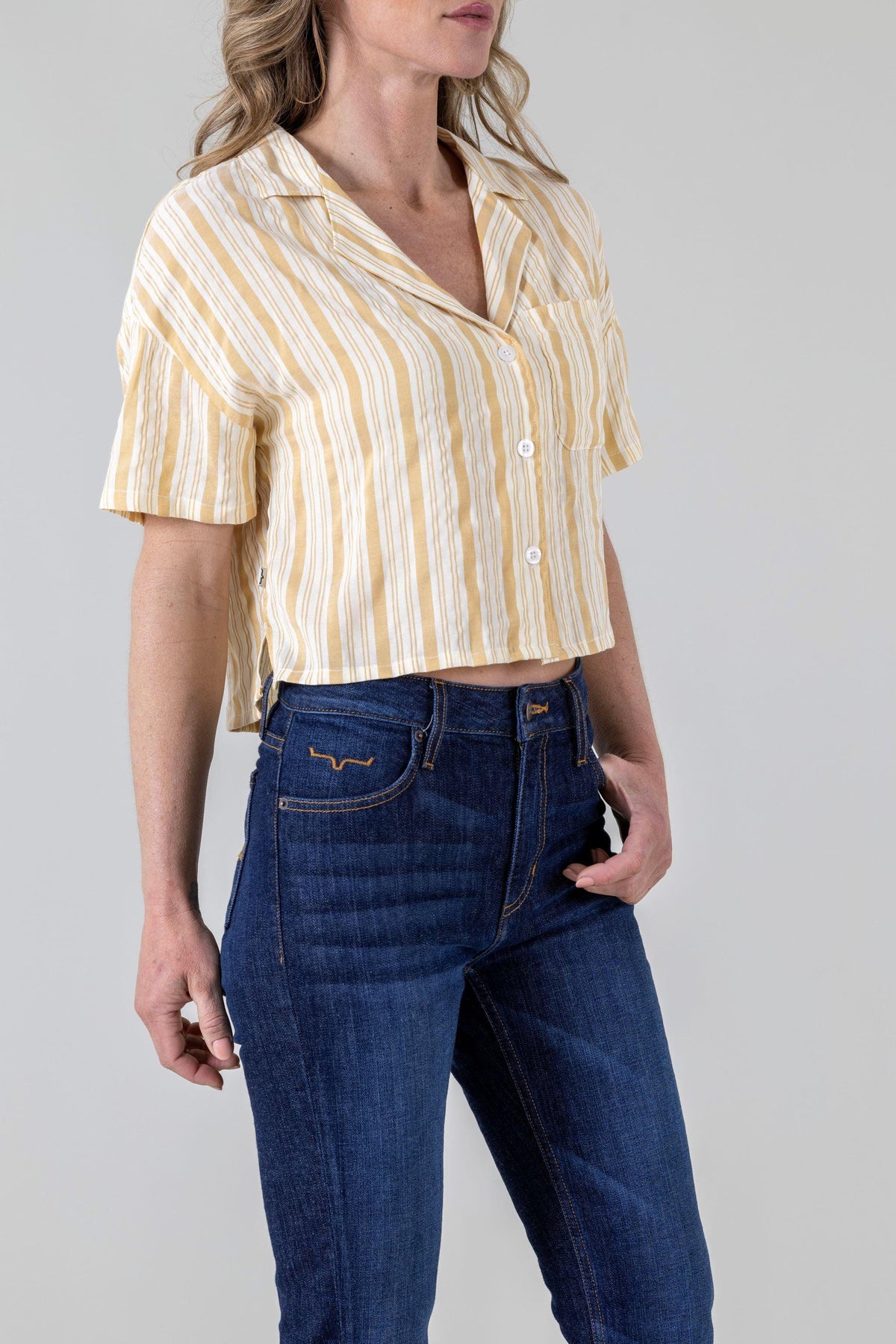Kimes Ranch Ferris Top in Yellow Ocre, side view, with short sleeves and a button front