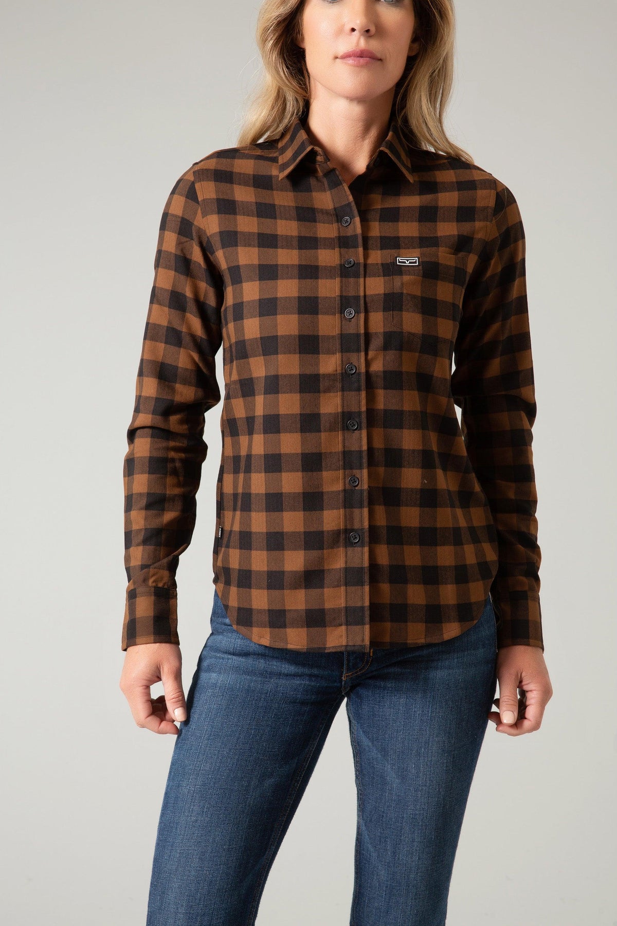 Kimes Ranch Ladies Garrison long sleeve button-up top in brown and black buffalo plaid with chest pocket and logo