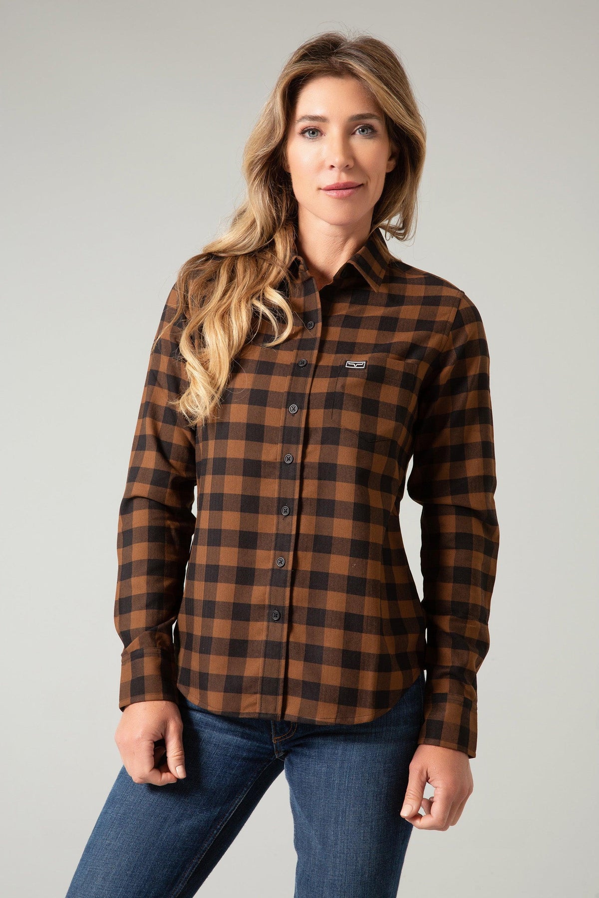Kimes Ranch Ladies Garrison long sleeve plaid top in brown and black with a chest pocket and logo
