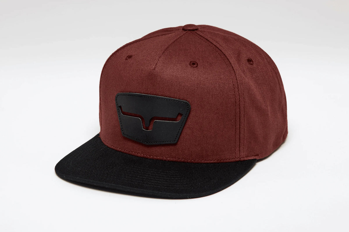 Kimes Ranch Ghost Face Hat in Rust, side view, with a black brim and Kimes Ranch logo patch