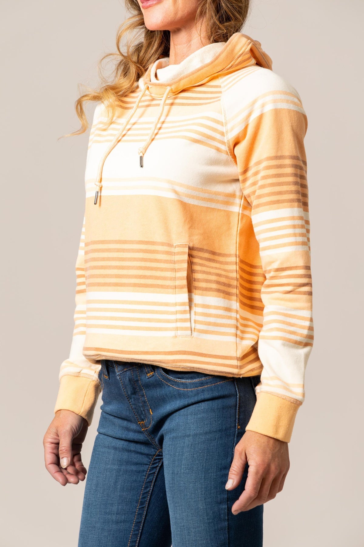 Kimes Ranch Golinda Pullover Hoodie in Orange, side view, with horizontal stripes and a front kangaroo pocket