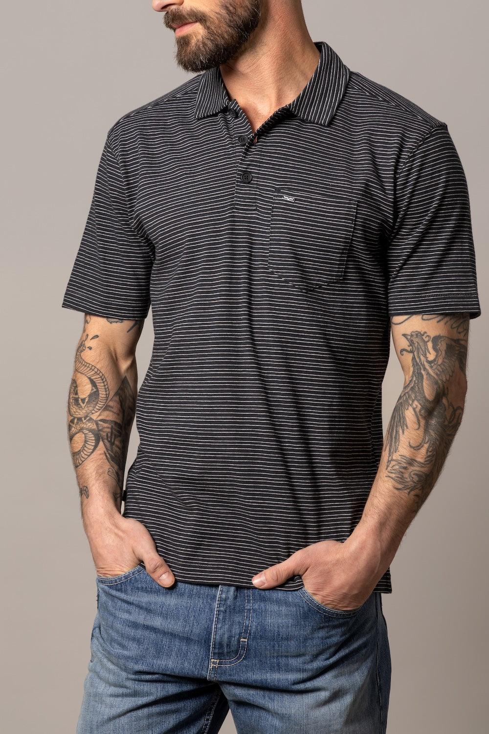 Kimes Ranch Harlan Polo in Black with white horizontal stripes, a collar, and a chest pocket with the Kimes Ranch logo