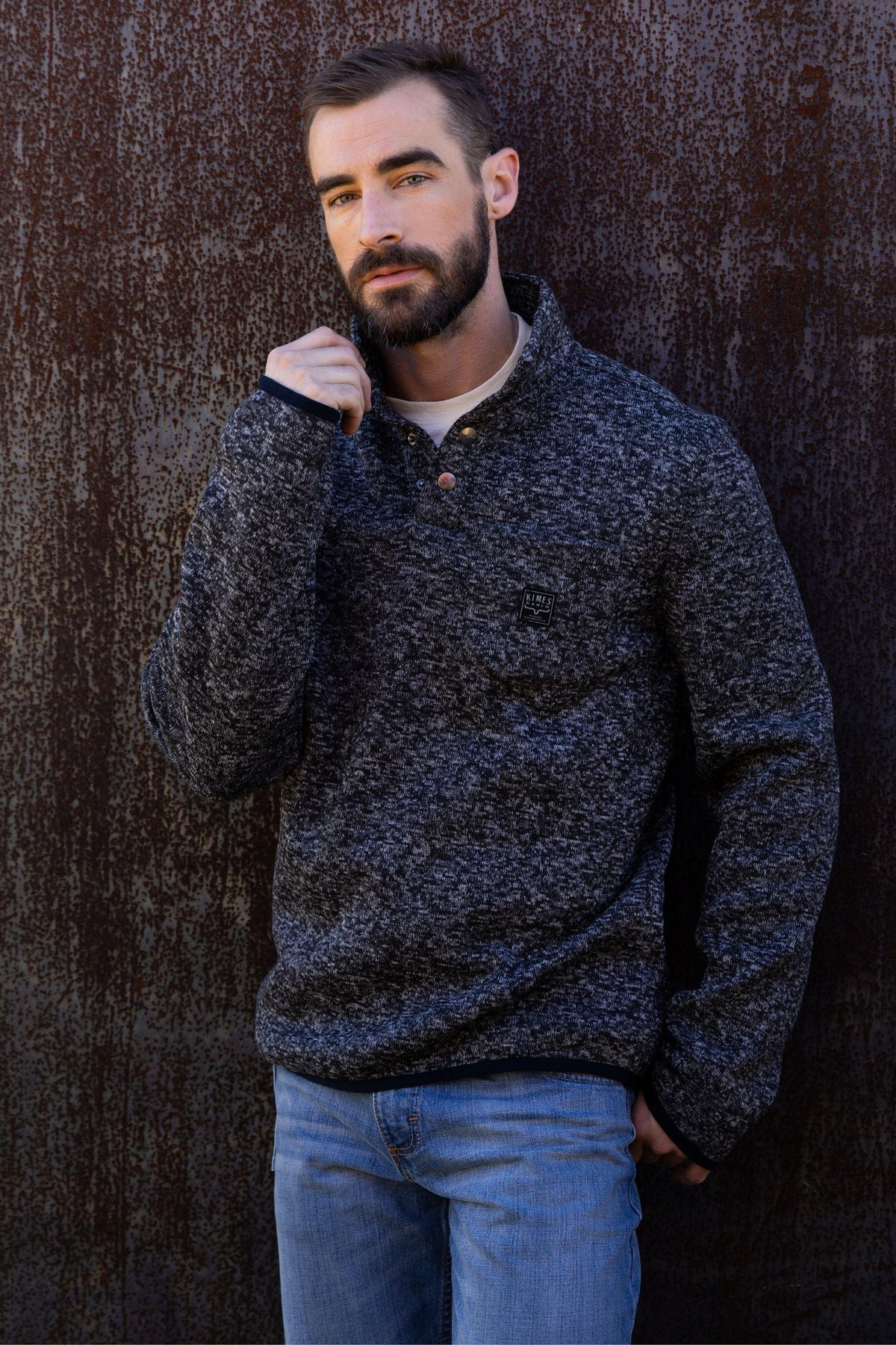 Kimes Ranch Julian Pullover sweatshirt in Black with a front pocket and logo