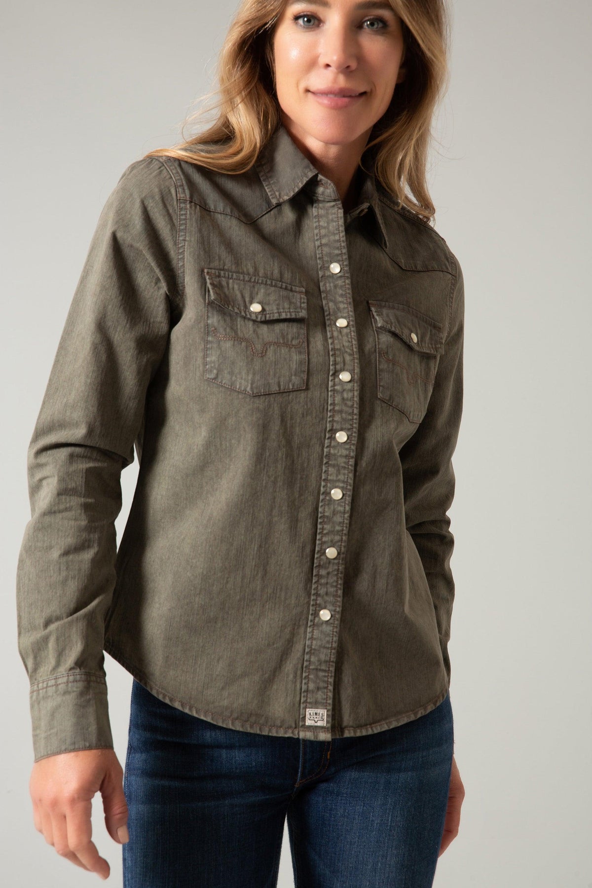 Kimes Ranch Kaycee Denim Top in Od Army with a western yoke, two chest pockets, and a button front closure