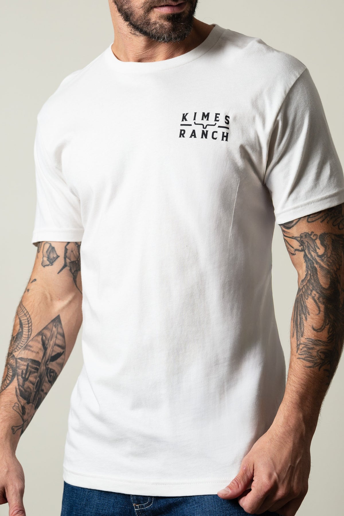Kimes Ranch Back Branded short-sleeve crewneck t-shirt in bone with black Kimes Ranch logo on left chest