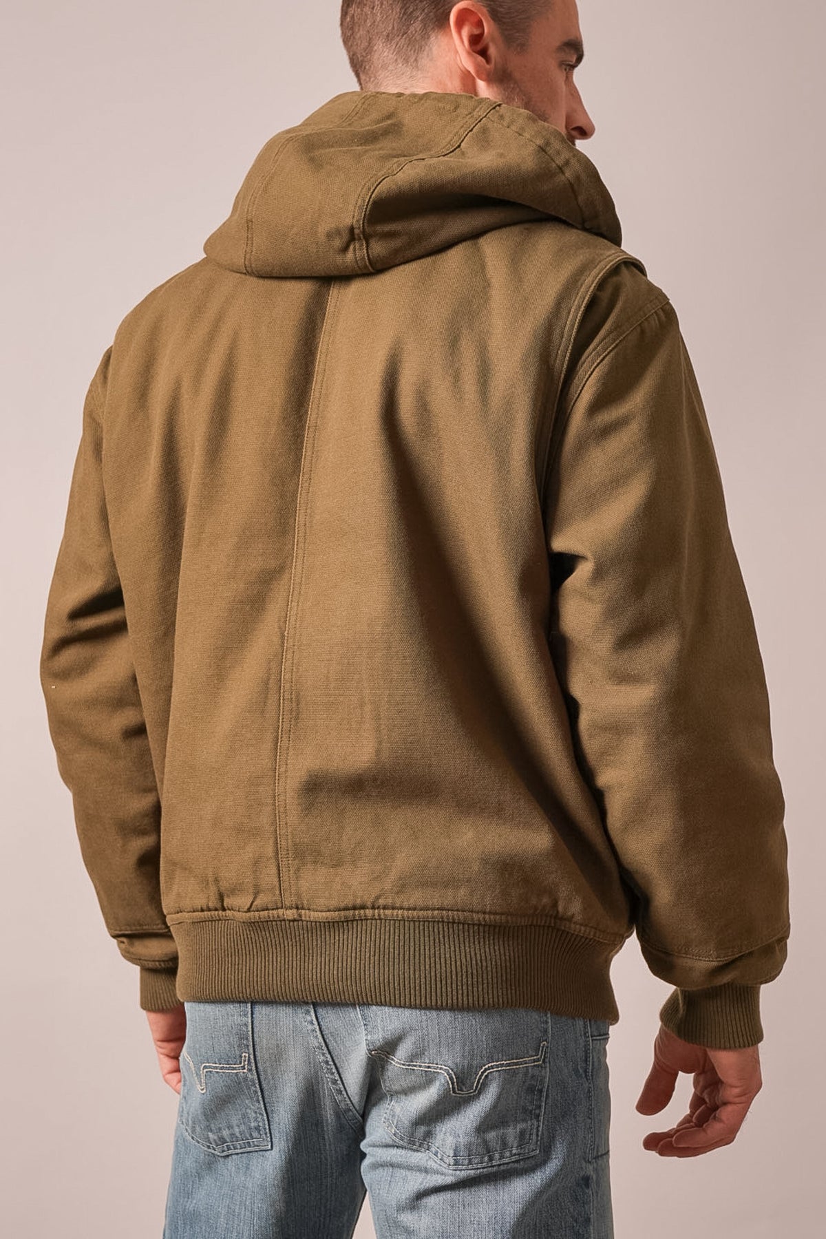 Kimes Ranch Bennett jacket in Army Green showing the back view with a hood, long sleeves, and ribbed hem and cuffs