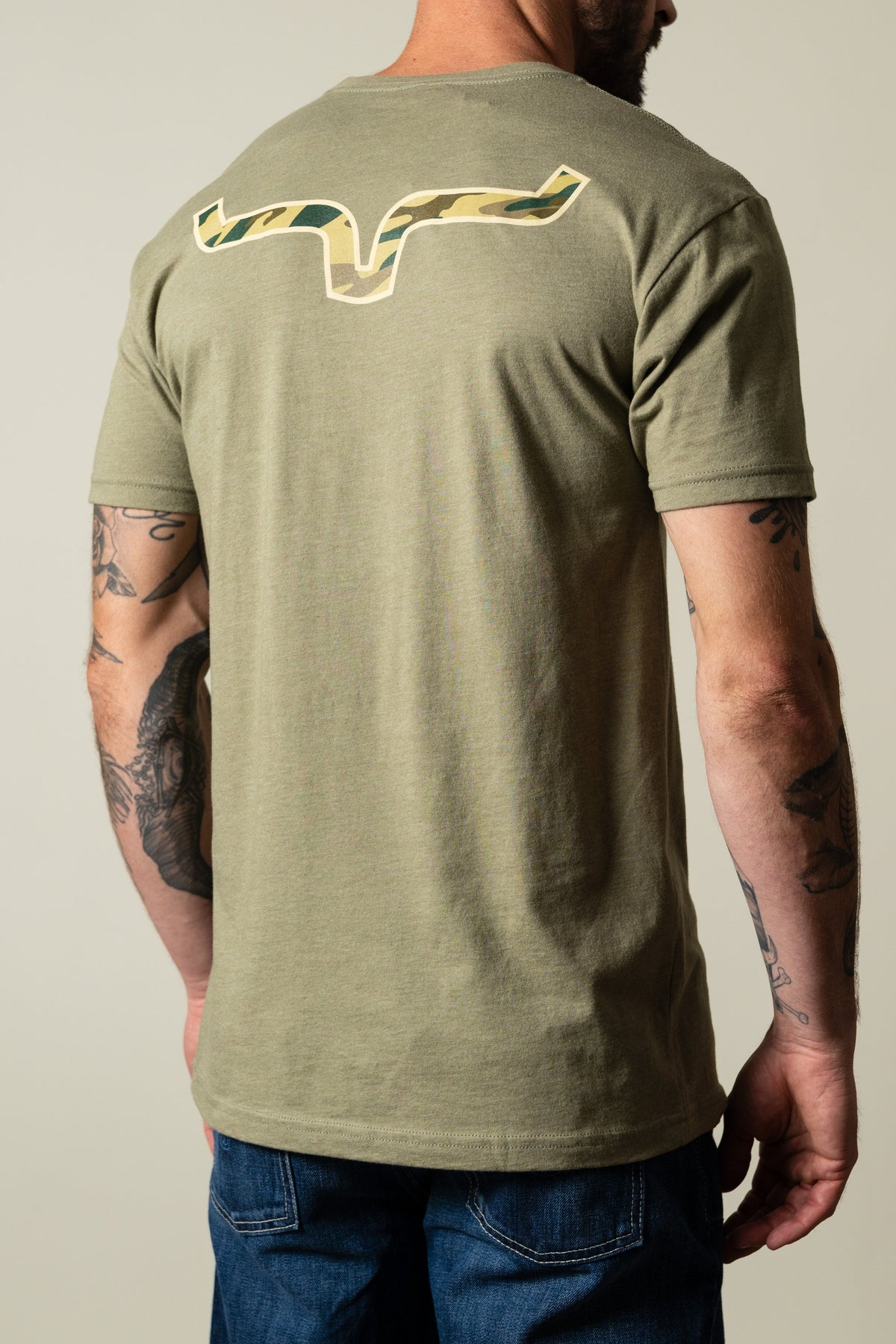 Kimes Ranch Camo Back light olive t-shirt with camo print Kimes Ranch logo on the back