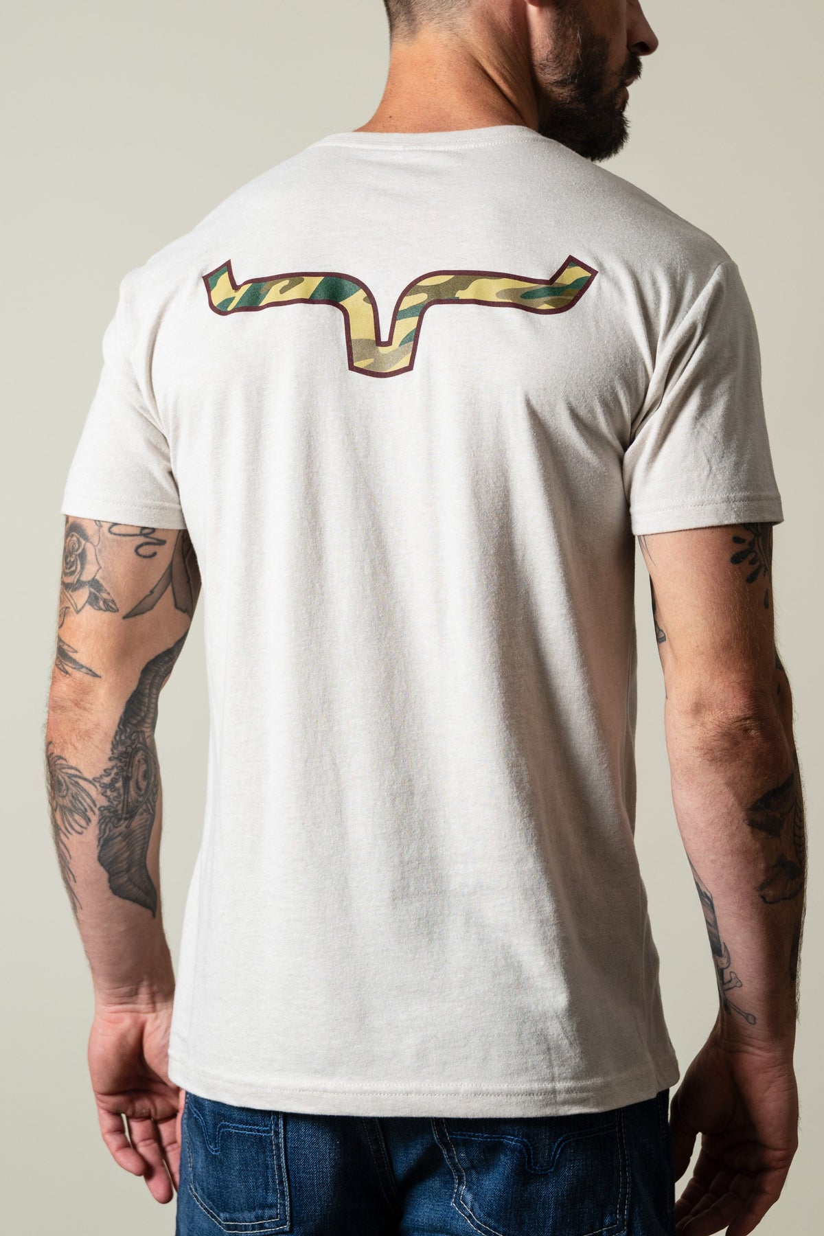 Kimes Ranch Camo Back t-shirt in sand, featuring the Kimes Ranch logo across the upper back