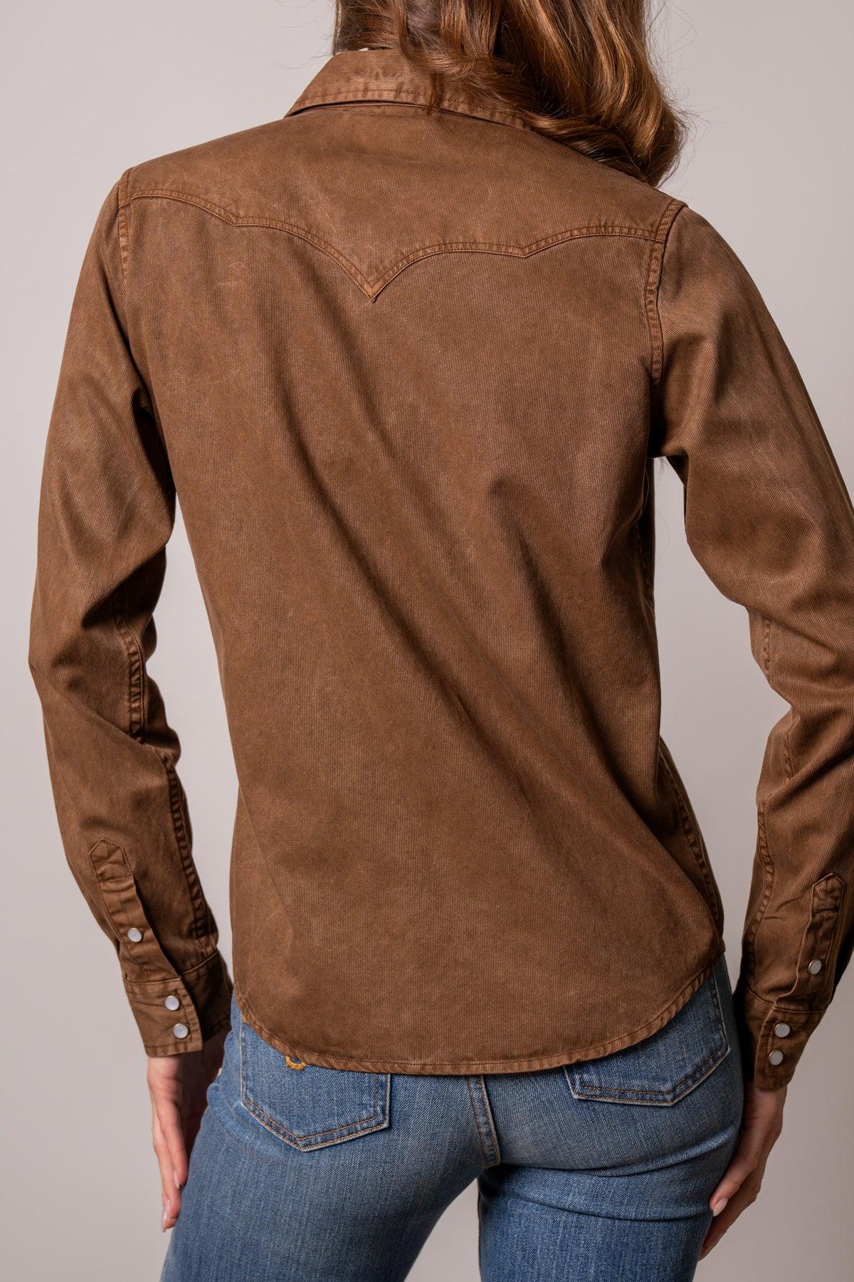Kimes Ranch Della Brown long sleeve top with western yoke stitching and buttoned cuffs