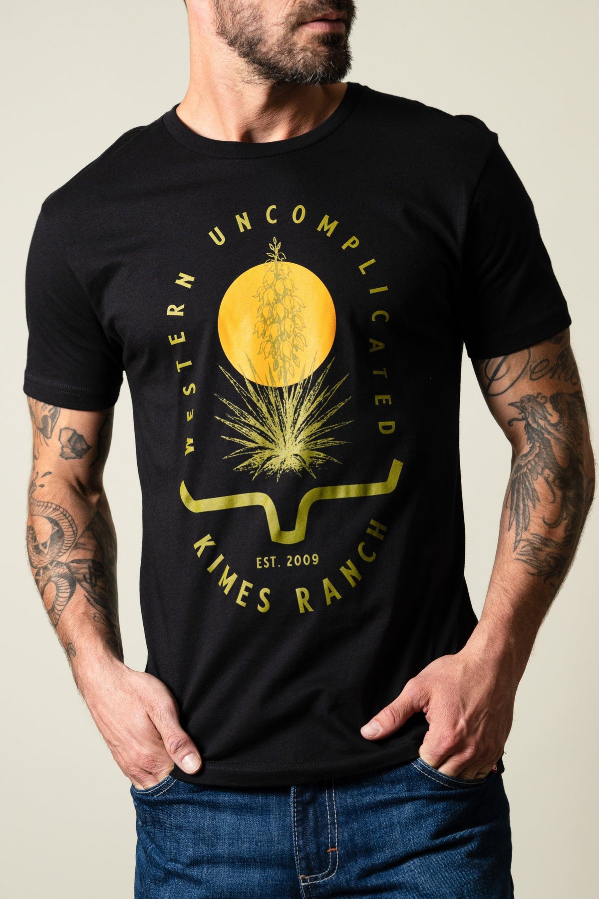 Kimes Ranch Drought Resistant shirt in black with yellow graphic, 'WESTERN UNCOMPLICATED', 'EST. 2009', and Kimes Ranch logo