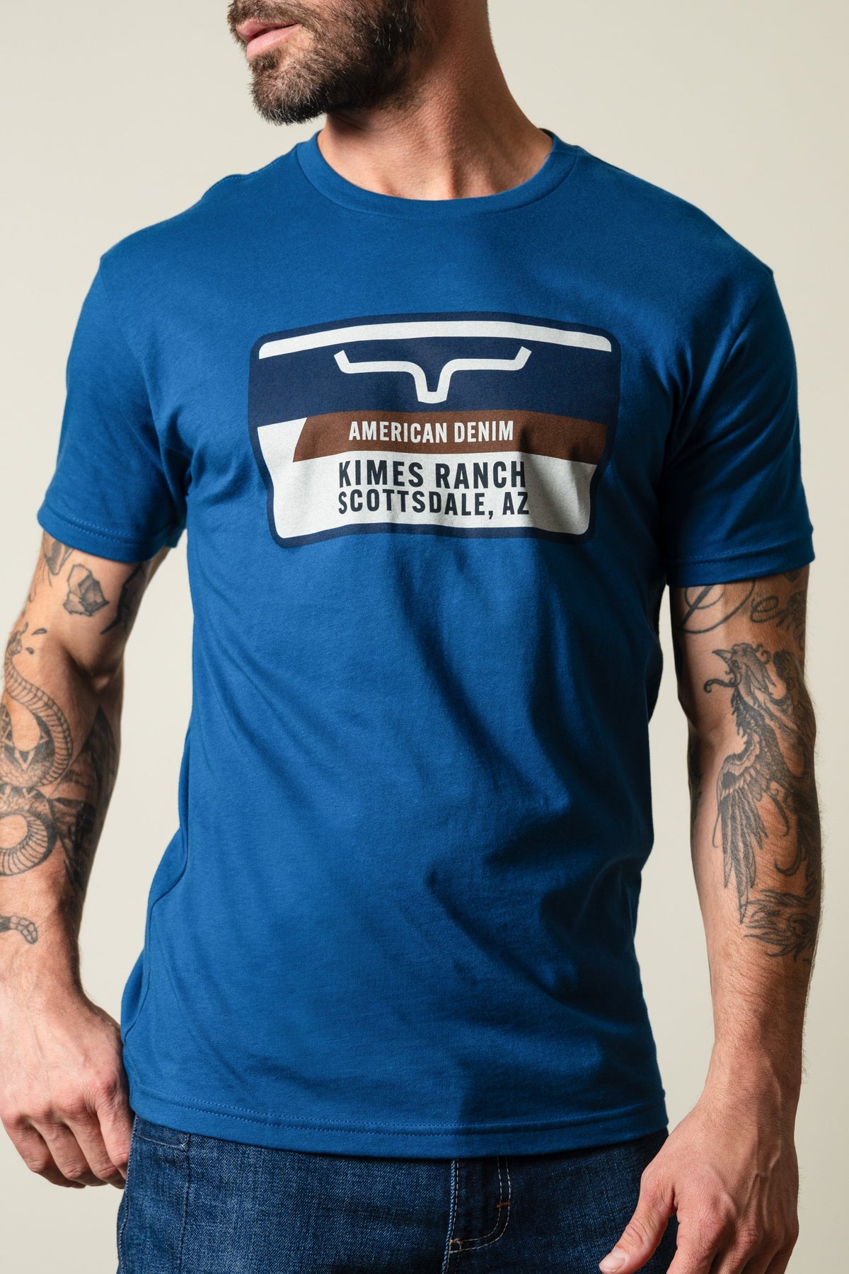 Kimes Ranch Feed Store Cool Blue short sleeve shirt with rectangular graphic showing Kimes Ranch Scottsdale, AZ