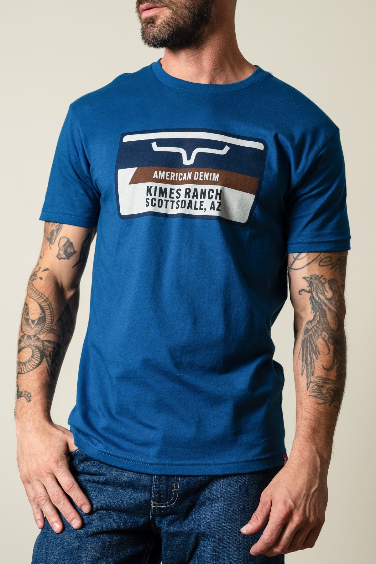 Men's Cool Blue Kimes Ranch Feed Store t-shirt with Kimes Ranch logo and "AMERICAN DENIM SCOTTSDALE, AZ" graphic