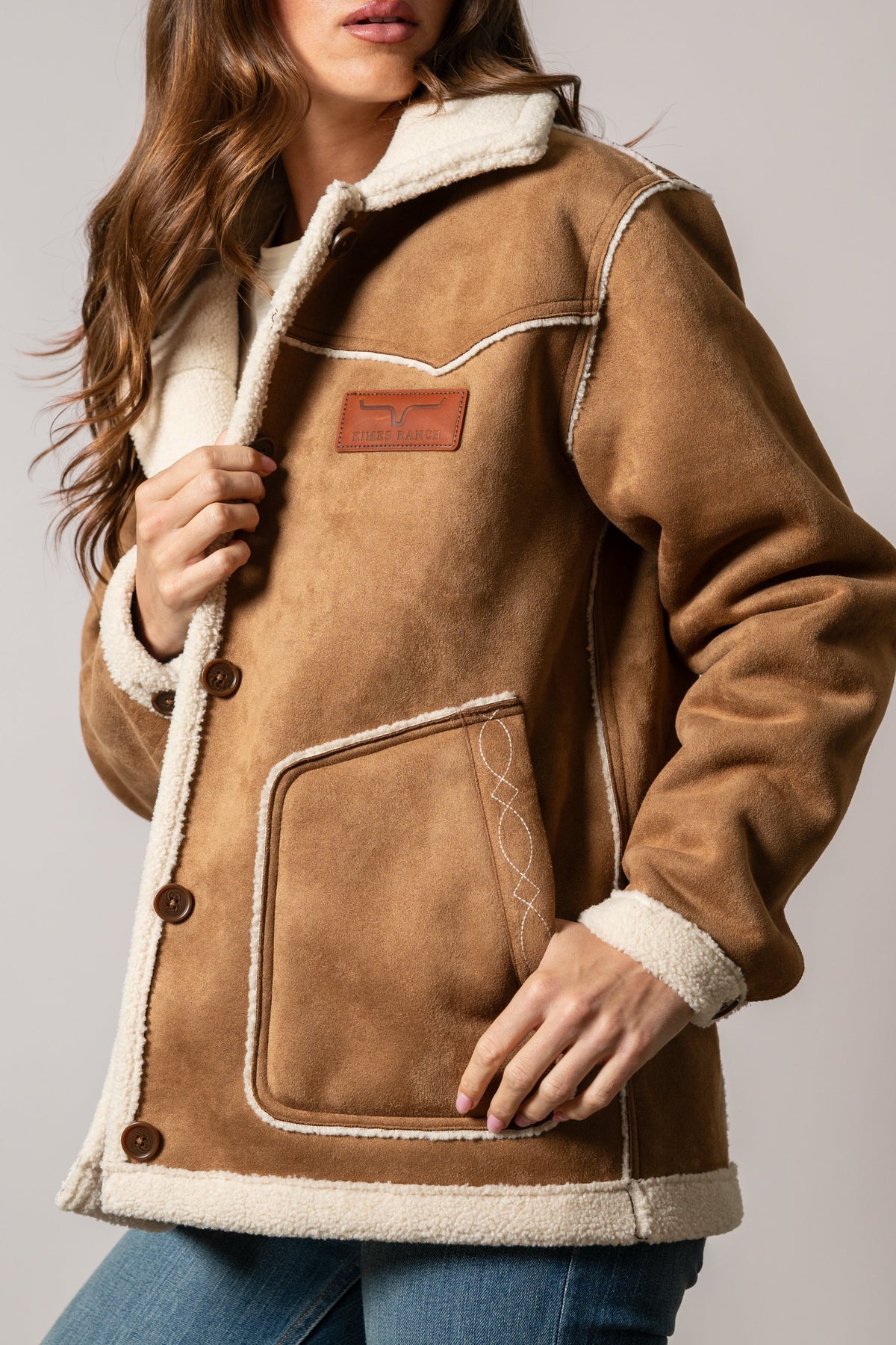 Kimes Ranch Hanna Jacket in Tobacco with off-white shearling trim, Kimes Ranch logo patch, and decorative stitching