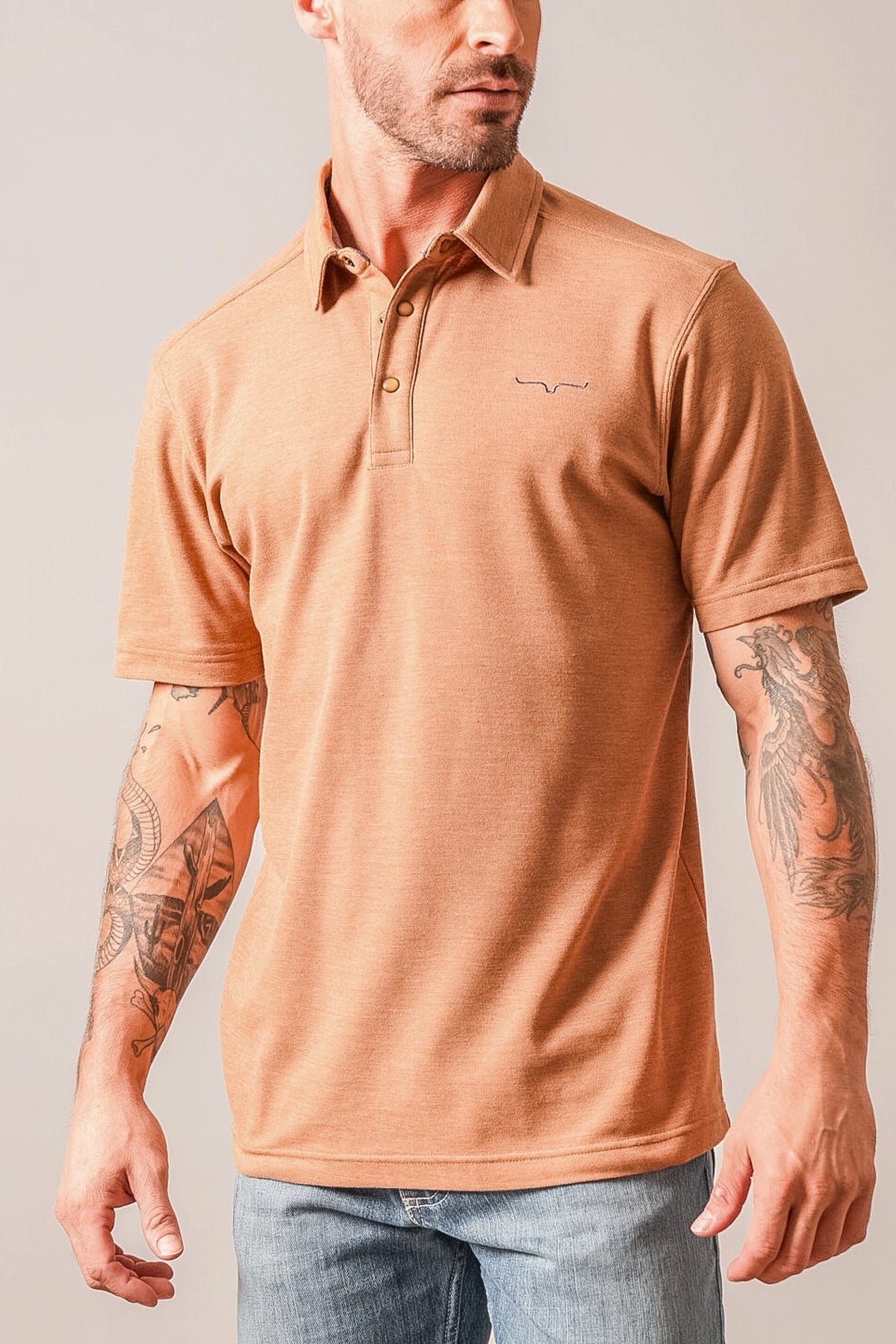 Kimes Ranch Kingsley polo in Brown Heather with a collar, short sleeves, and the Kimes Ranch logo on the chest