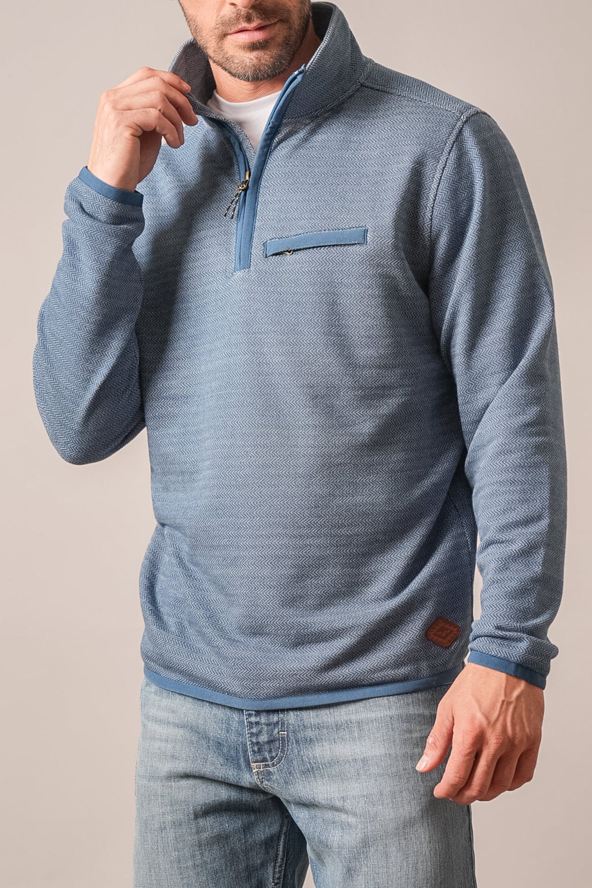 Kimes Ranch Lambert sweatshirt in blue with a heathered knit texture, a quarter-zip closure, a chest pocket, and long sleeves