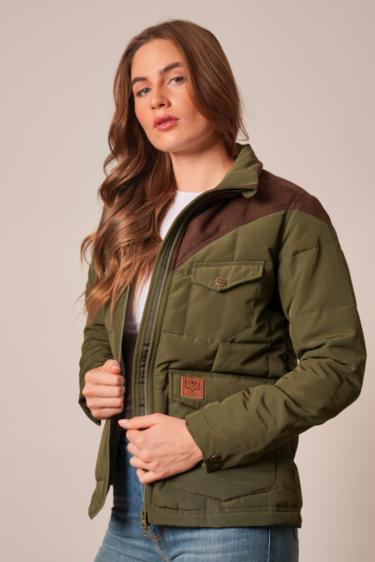 Kimes Ranch Lenora jacket in dark olive with brown contrast yoke, zip front, flap pocket, and logo patch