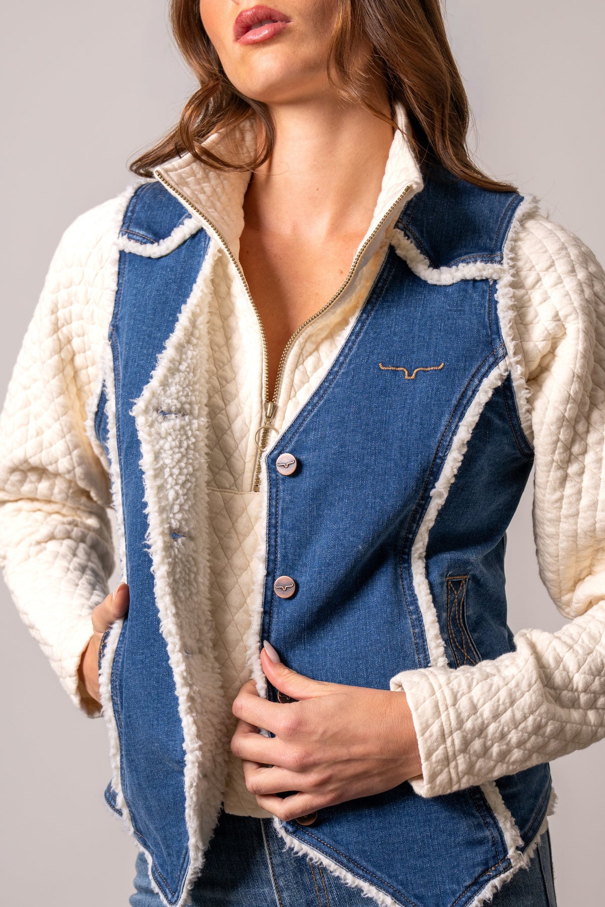Kimes Ranch Loni Vest, blue denim with white sherpa collar, white quilted sleeves, Kimes Ranch logo, and buttons