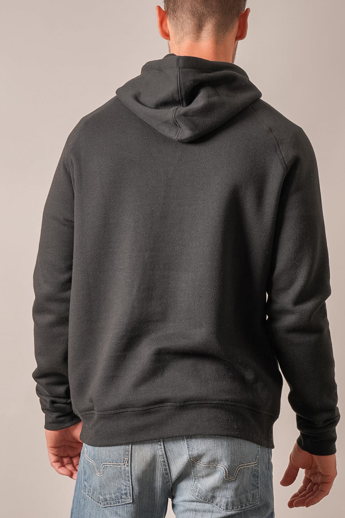 Kimes Ranch Outlier hoodie in black with white contrast stitching on back pockets