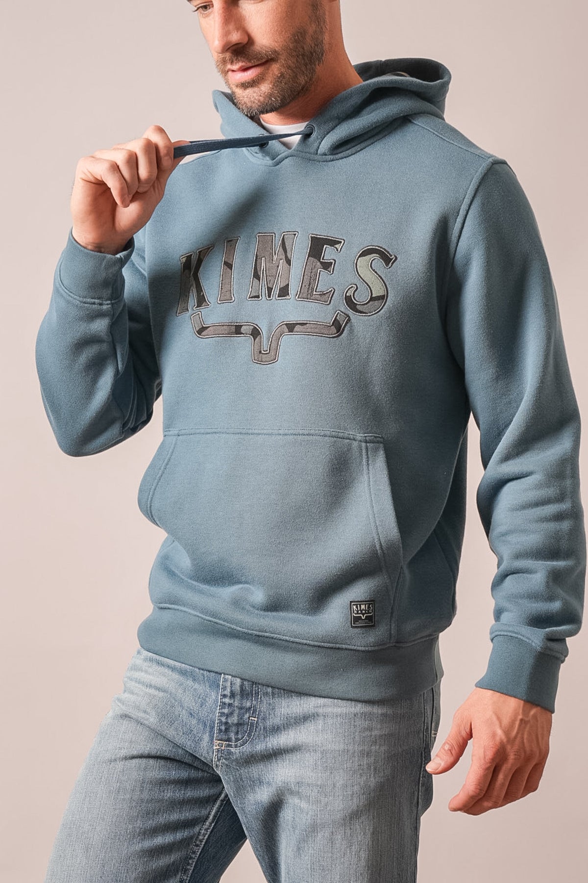 Kimes Ranch Riddle hoodie in Dark Blue with arched KIMES graphic on chest, kangaroo pocket, long sleeves, and logo tag on hem