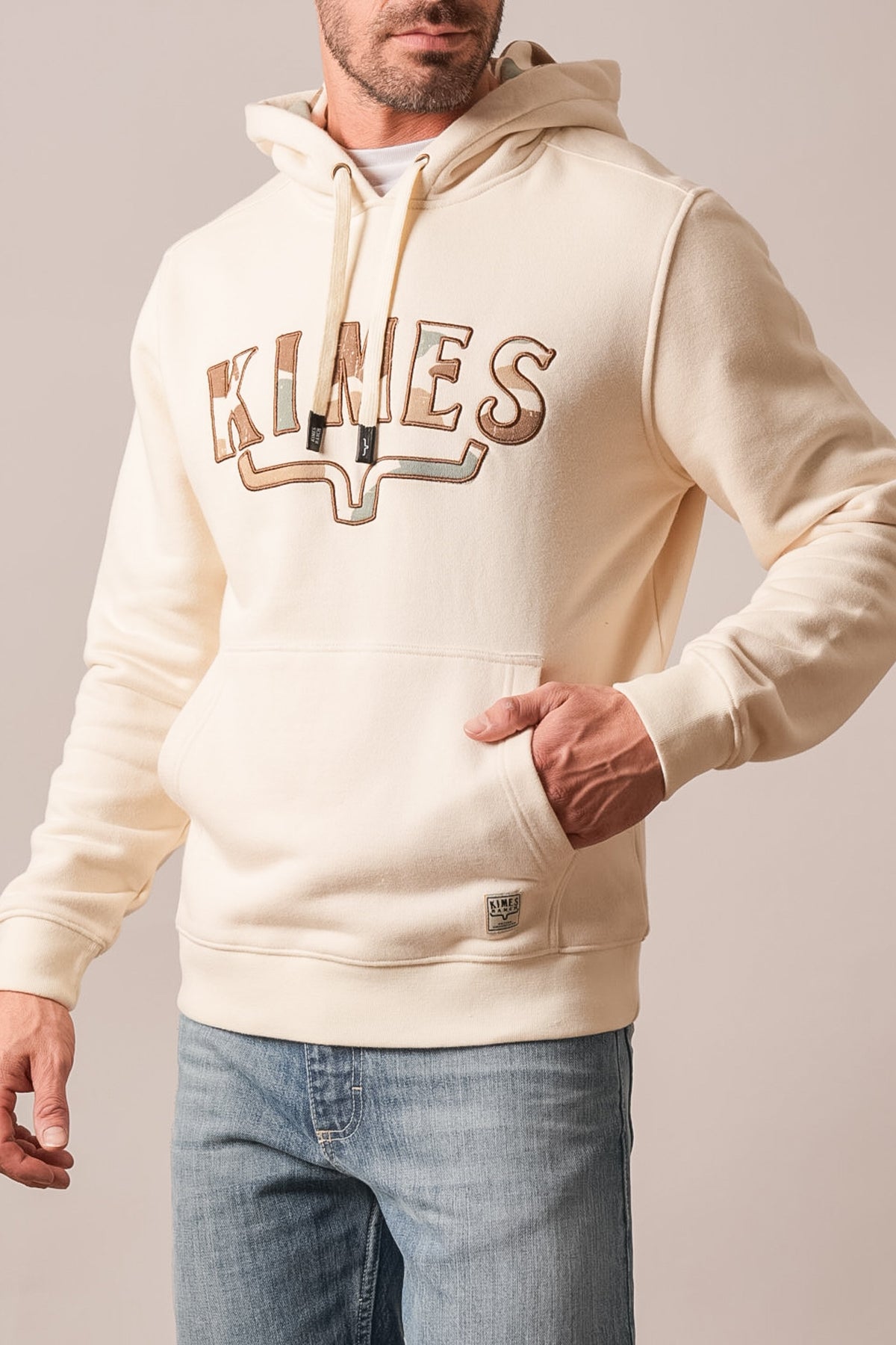 Kimes Ranch Riddle hoodie in Natural with embroidered "KIMES" wordmark and kangaroo pocket
