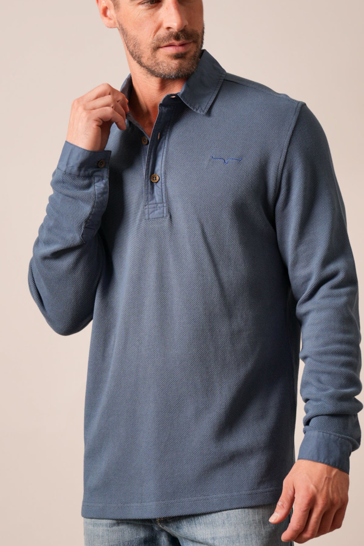 Kimes Ranch Rockaway long sleeve polo in Dark Blue with Kimes Ranch logo and button placket
