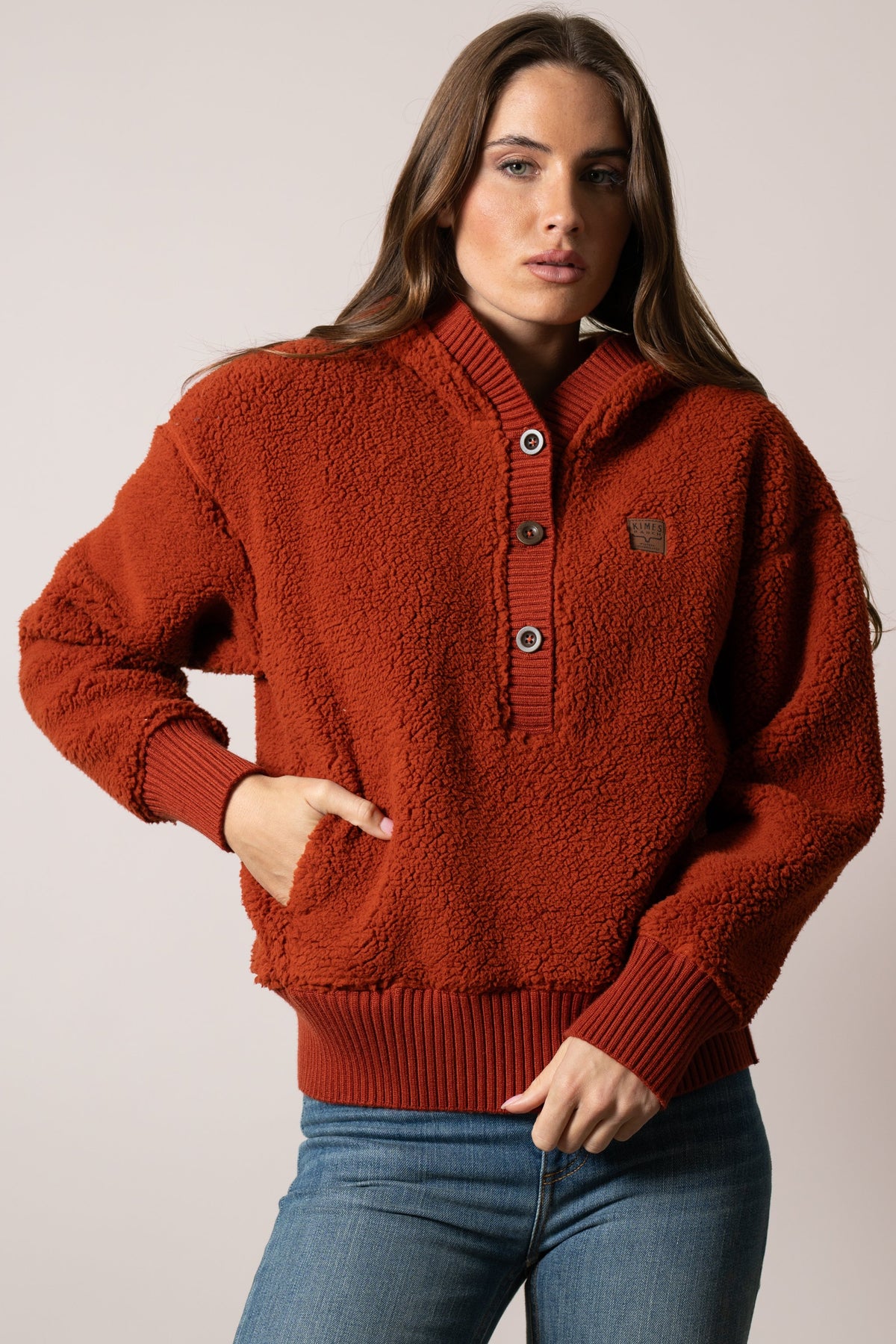 Kimes Ranch Shayla hoodie in Burnt Red with Kimes Ranch logo patch, long sleeves, and knit trim