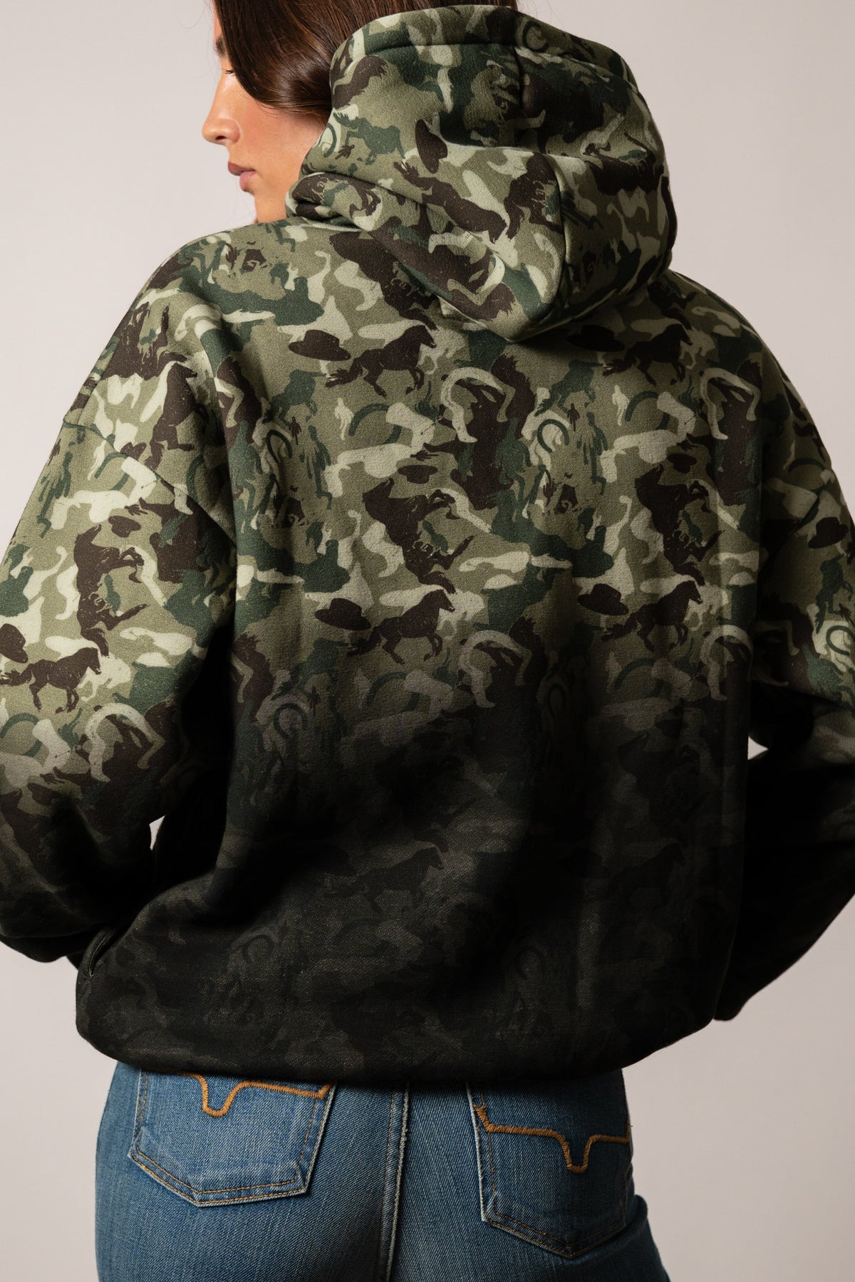 Kimes Ranch Sloane camo hoodie showing back view with horse silhouette pattern in green and brown tones