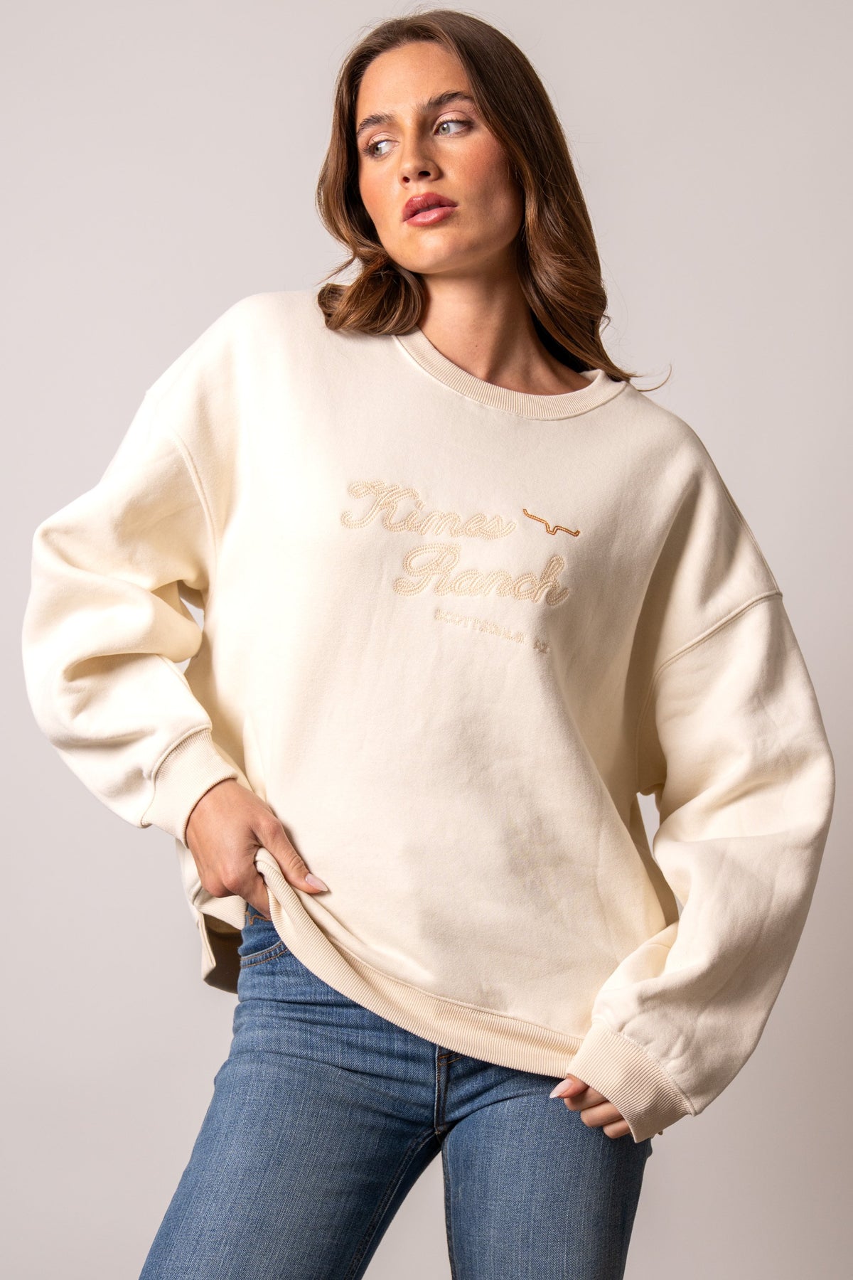 Kimes Ranch Solana Natural long-sleeve crewneck sweatshirt featuring tonal embroidered Kimes Ranch logo on the chest