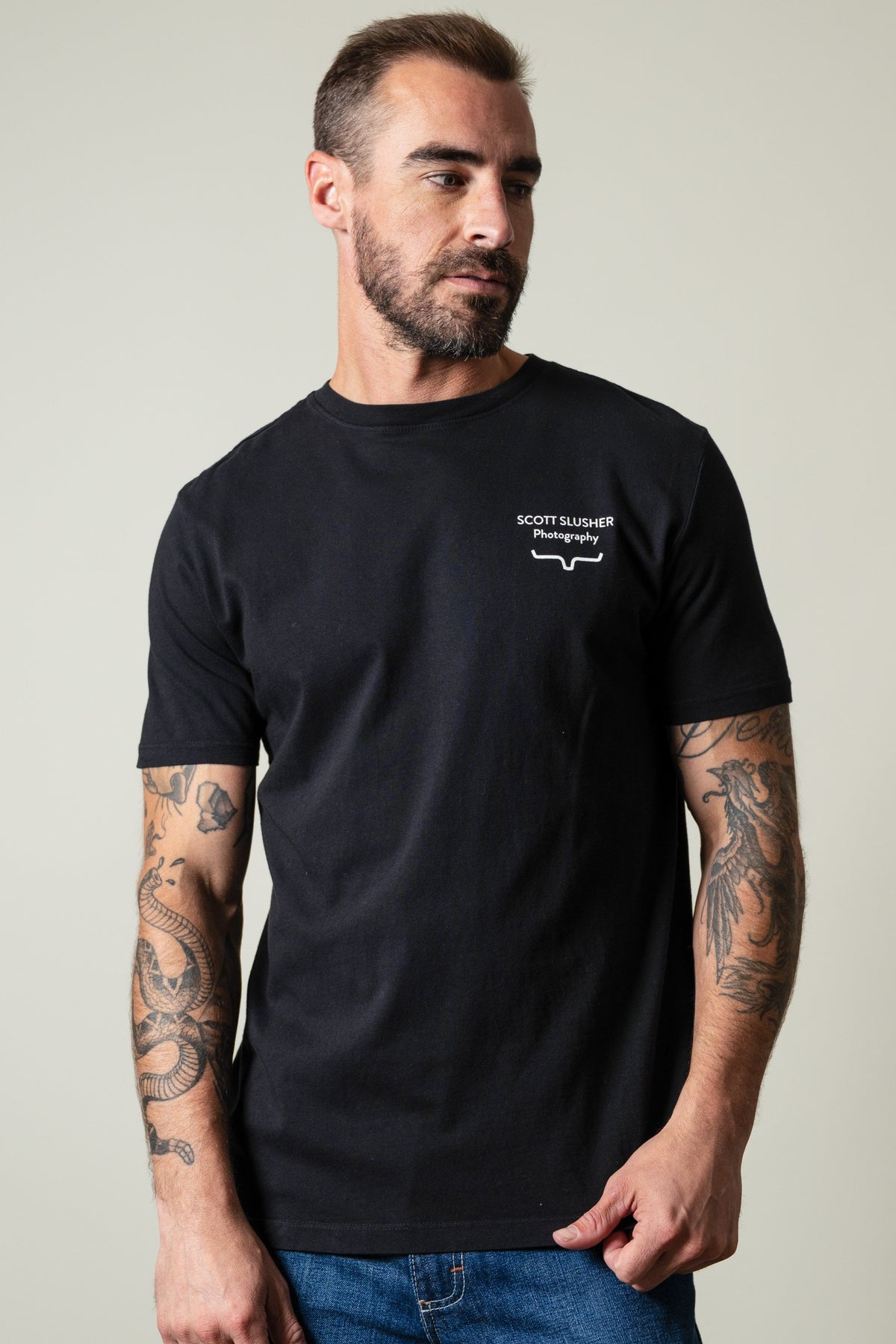 Kimes Ranch SS Bronc Ride black t-shirt with SCOTT SLUSHER Photography graphic and Kimes Ranch logo