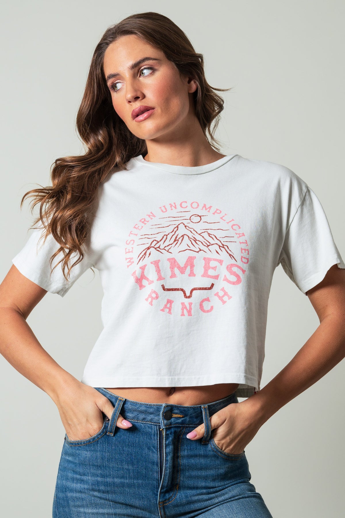 Kimes Ranch The Pass shirt in Natural with short sleeves, crewneck and a front graphic of mountains with the text Western
