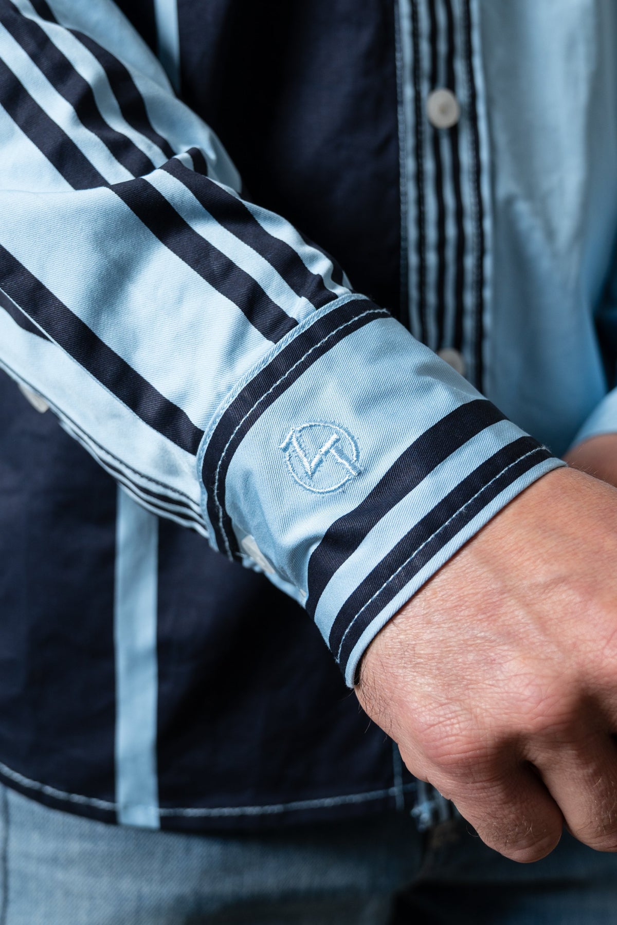 Kimes Ranch ZT 1 Arm Bandit dress shirt in light blue showing striped sleeve detail and embroidered logo on cuff