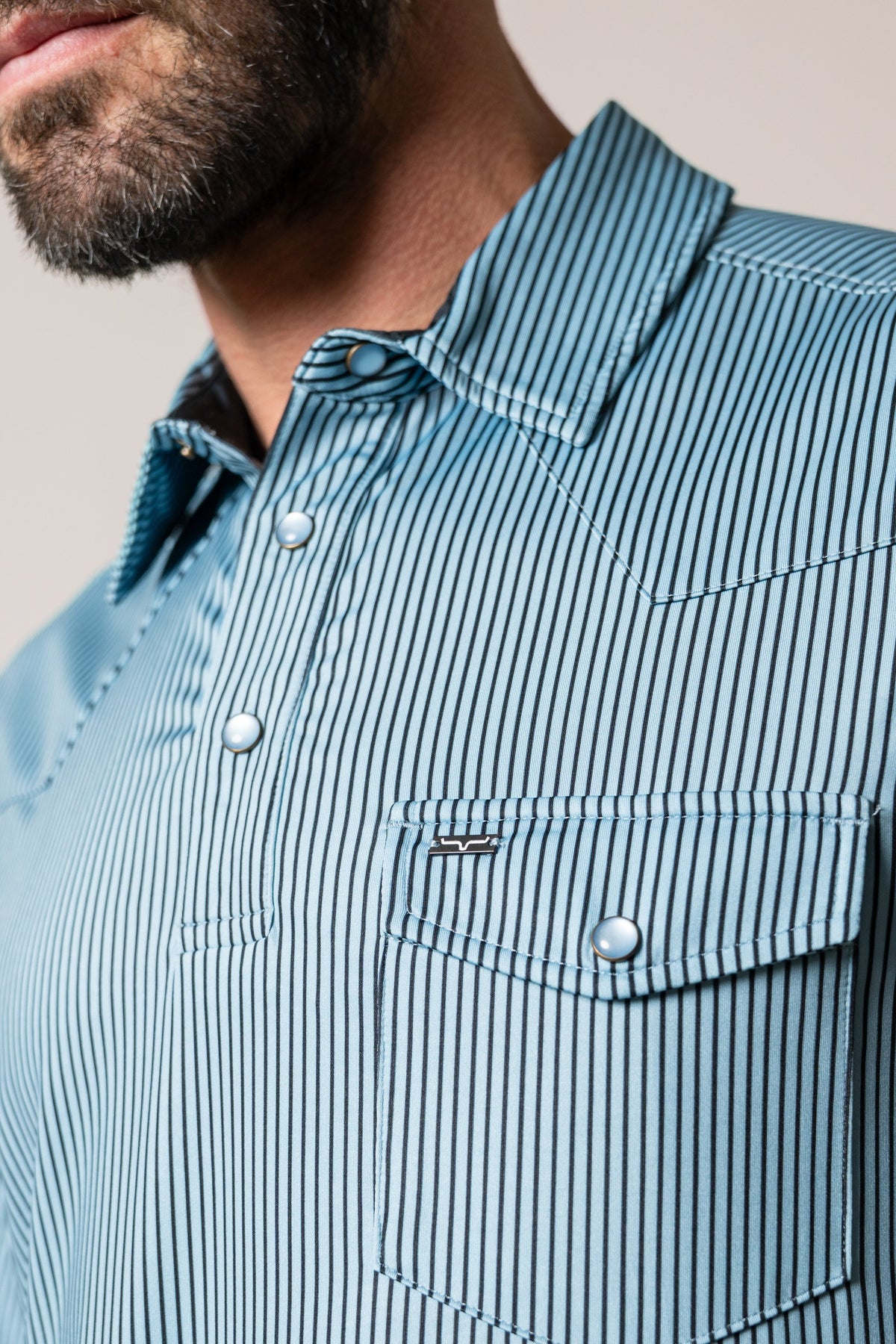 Kimes Ranch ZT Loomis polo shirt in light blue with dark blue stripes and chest pocket