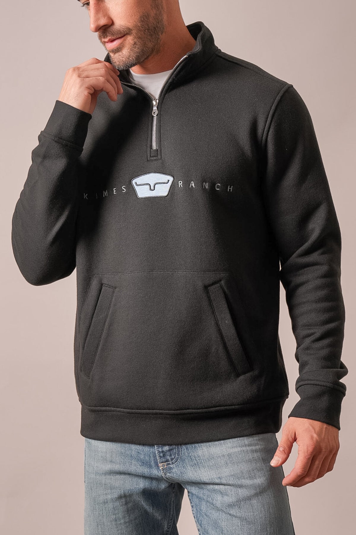 Kimes Ranch ZT Par Three black sweatshirt with half-zip, front kangaroo pockets, and embroidered Kimes Ranch logo on chest