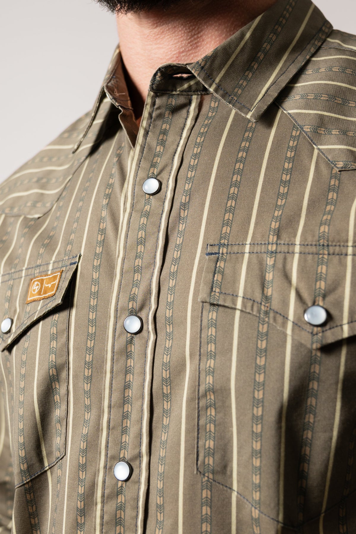 Kimes Ranch ZT Solano Army Green dress shirt with white button placket, two chest pockets, and contrasting stitching