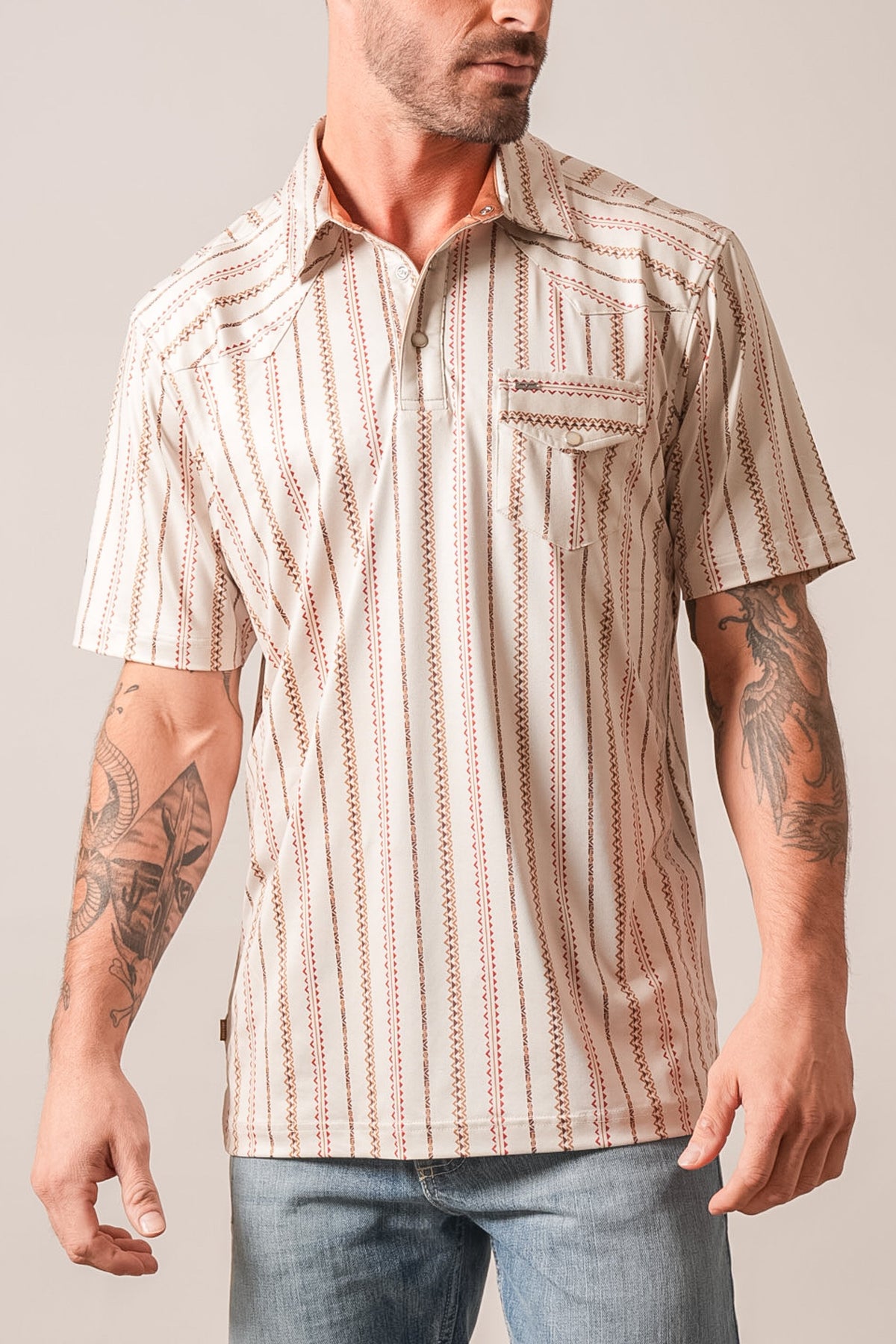 Kimes Ranch ZT Z-Stripe polo in Natural with red and brown zigzag stripes and Kimes Ranch logo
