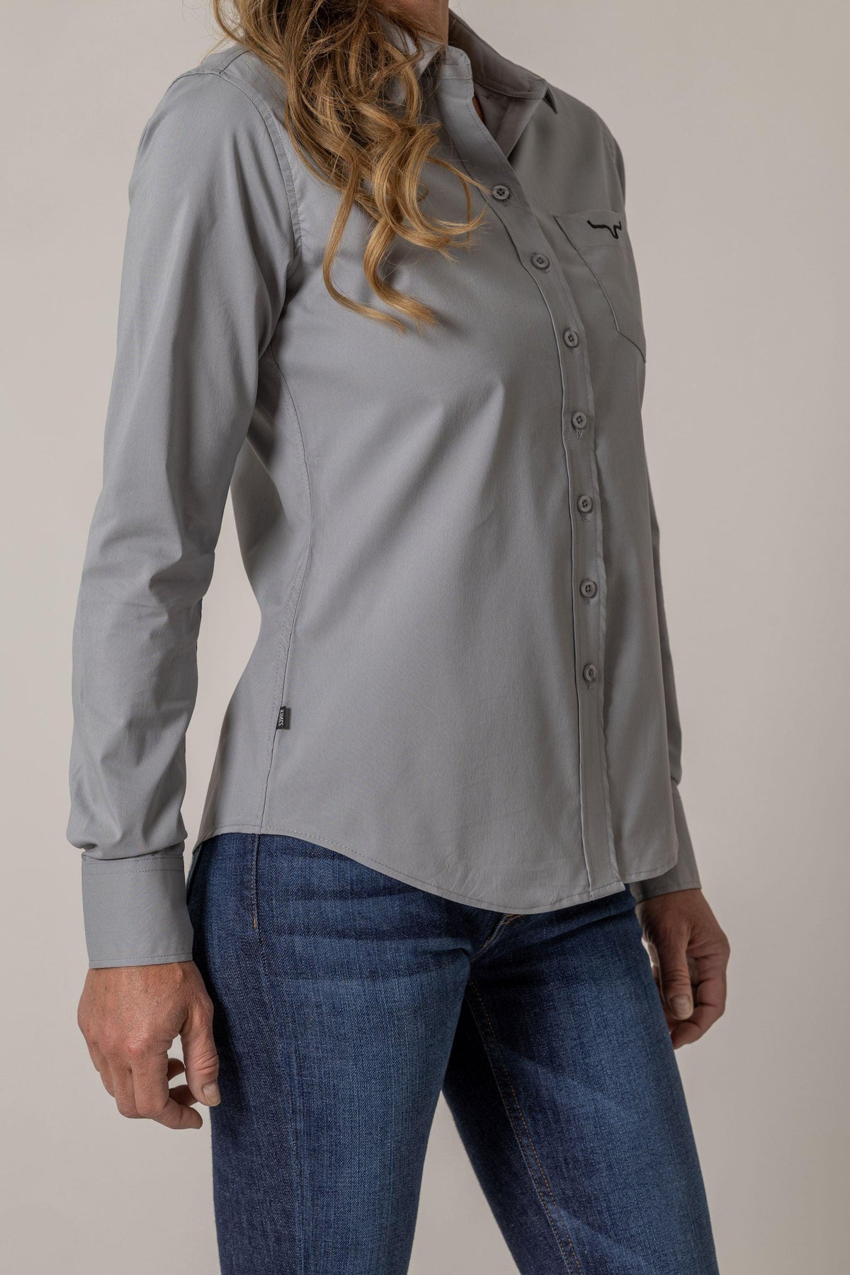 Kimes Ranch Ladies KR Team Shirt in Grey, side view, with long sleeves and a chest pocket with the Kimes Ranch logo