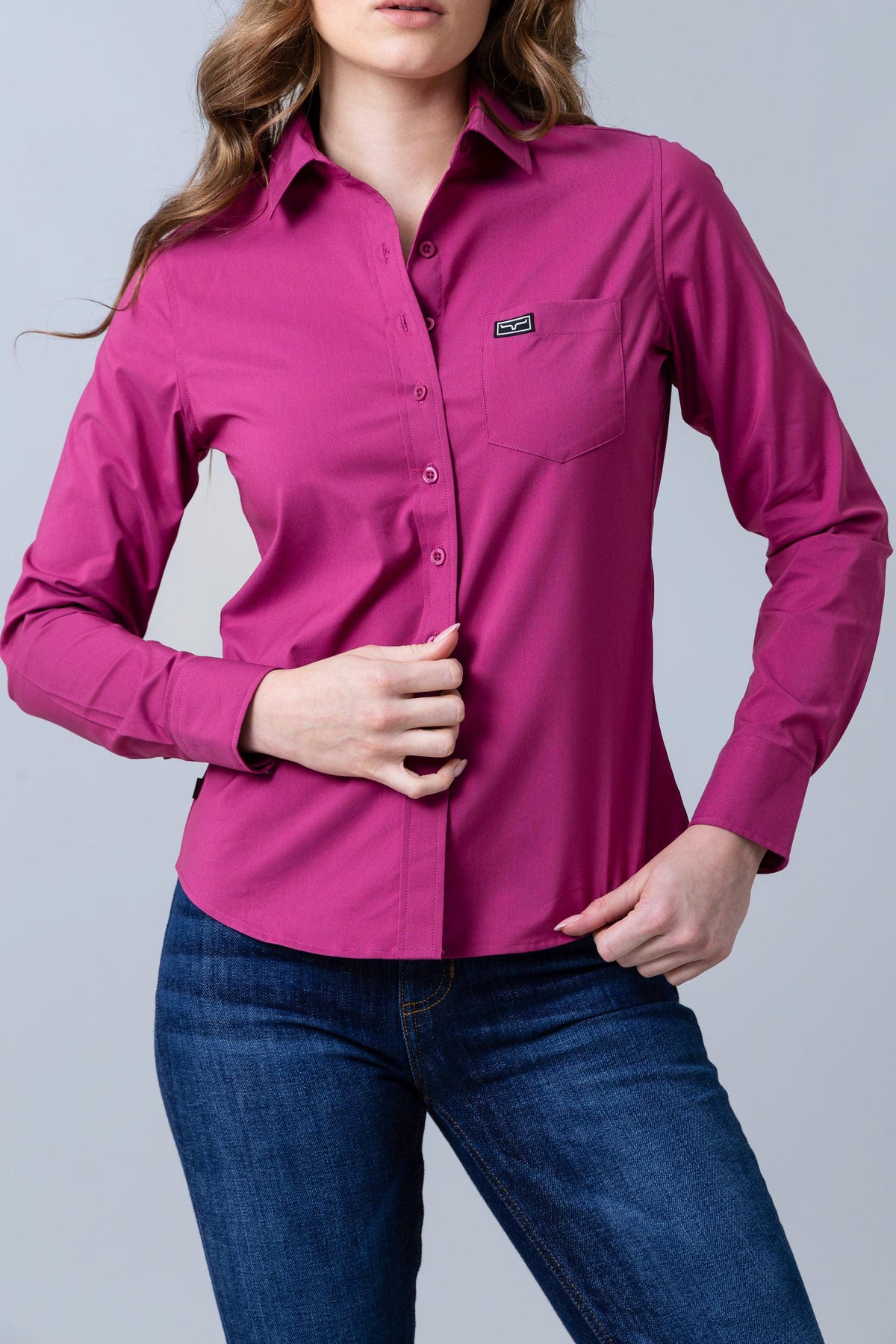 Kimes Ranch Ladies Linville long sleeve button-up top in Magenta with a chest pocket and logo