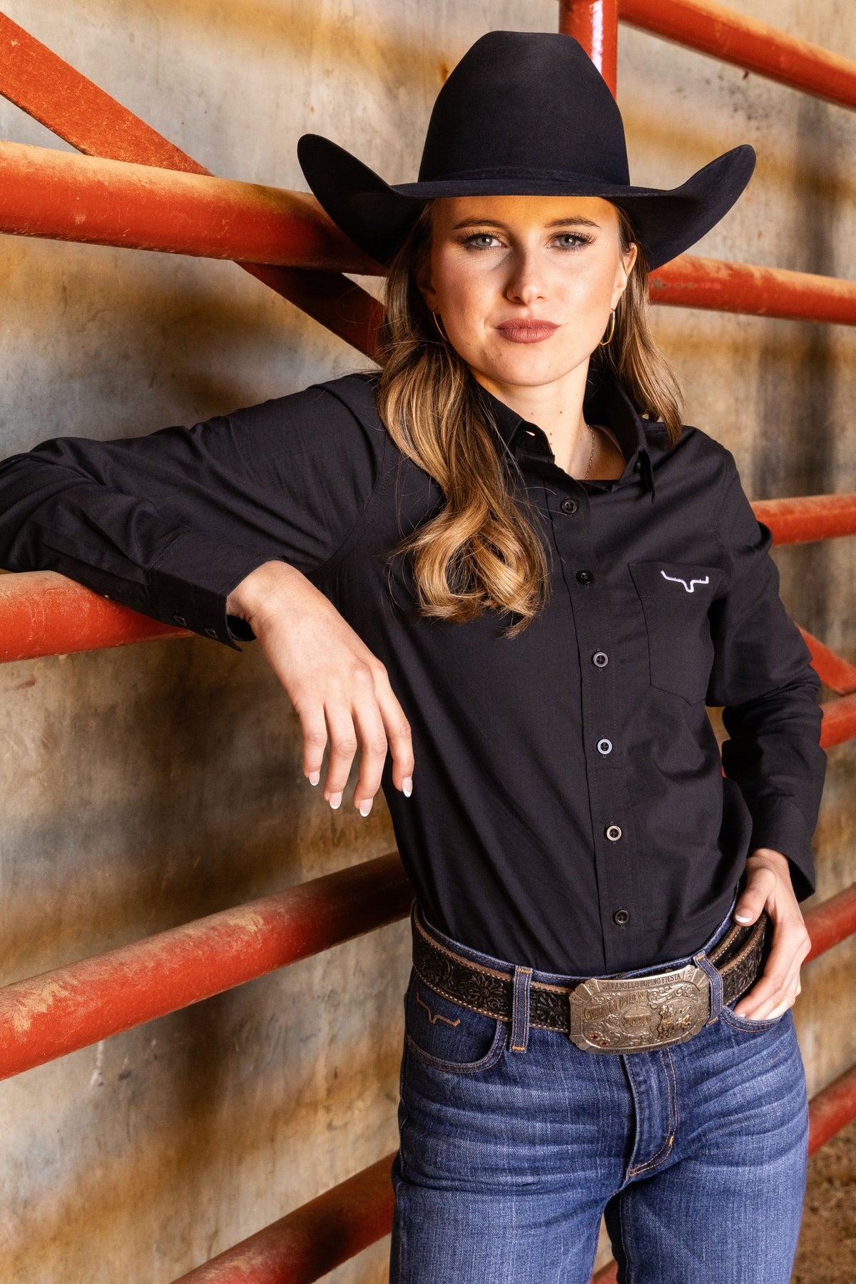 Kimes Ranch Ladies KR Team Shirt in Black with long sleeves, a button front, and a chest pocket with the Kimes Ranch logo