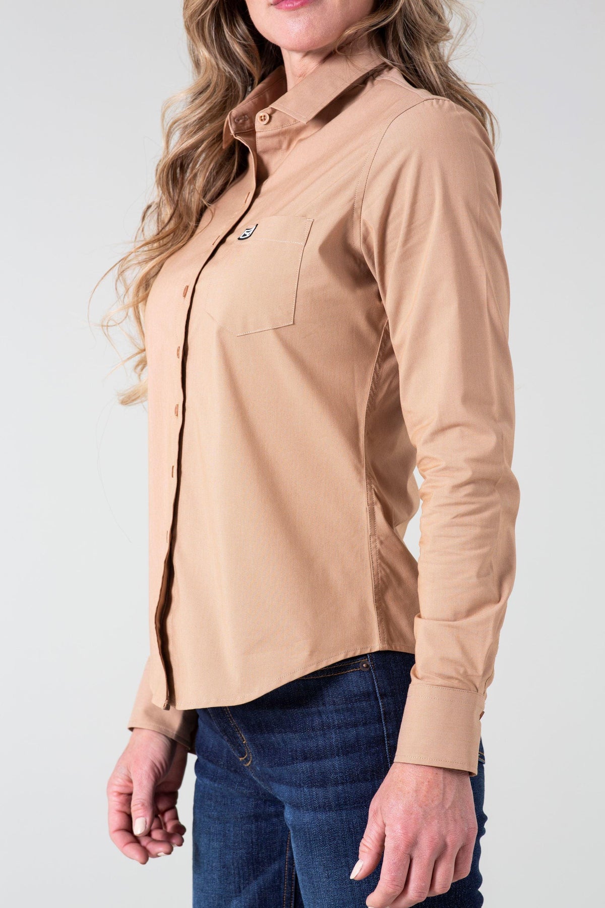 Kimes Ranch Ladies Linville top in Desert Brown, side view, with long sleeves and a chest pocket with logo