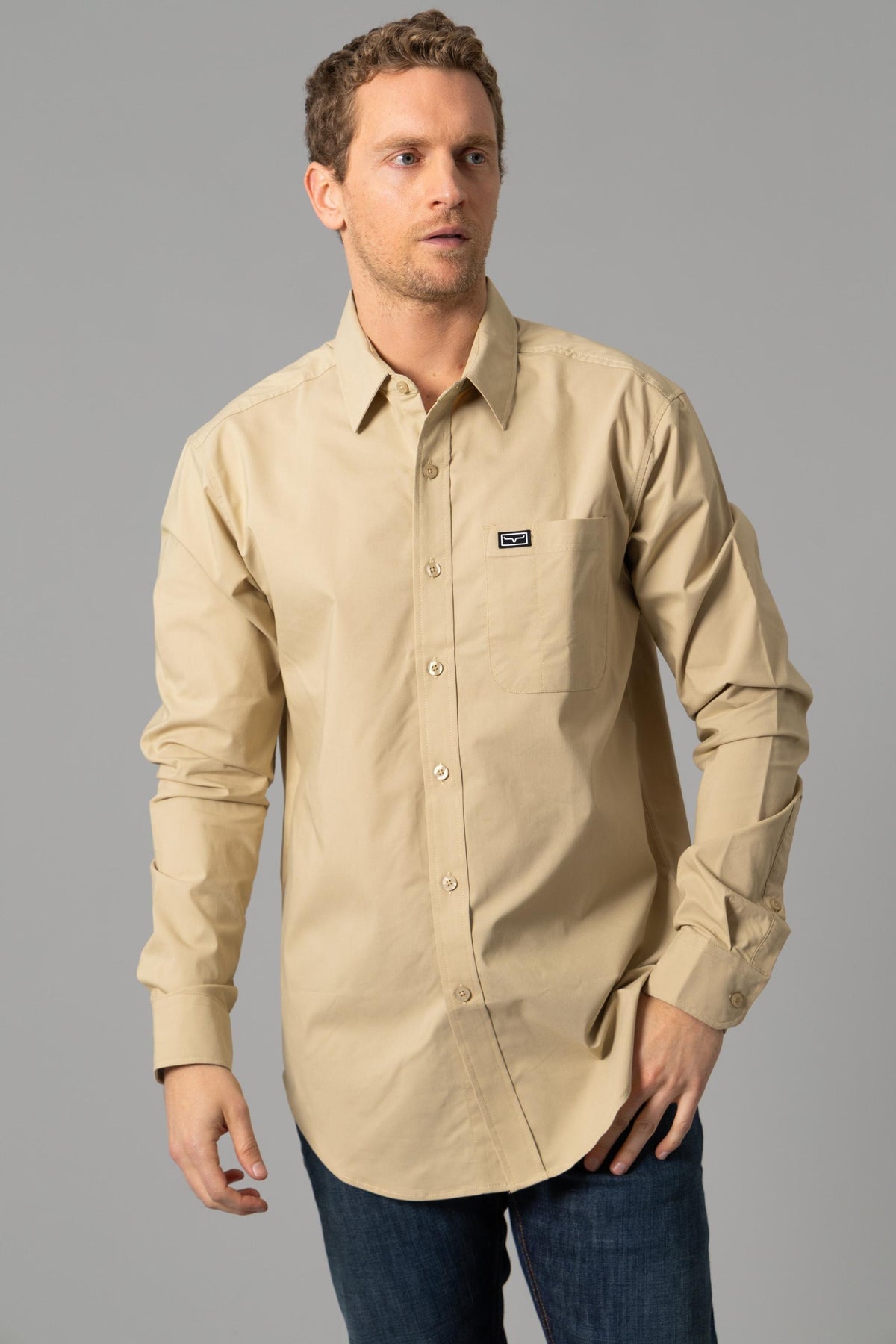 Kimes Ranch Linville Long Sleeve Dress Shirt in Khaki with a button-down collar and a chest pocket with the Kimes Ranch logo