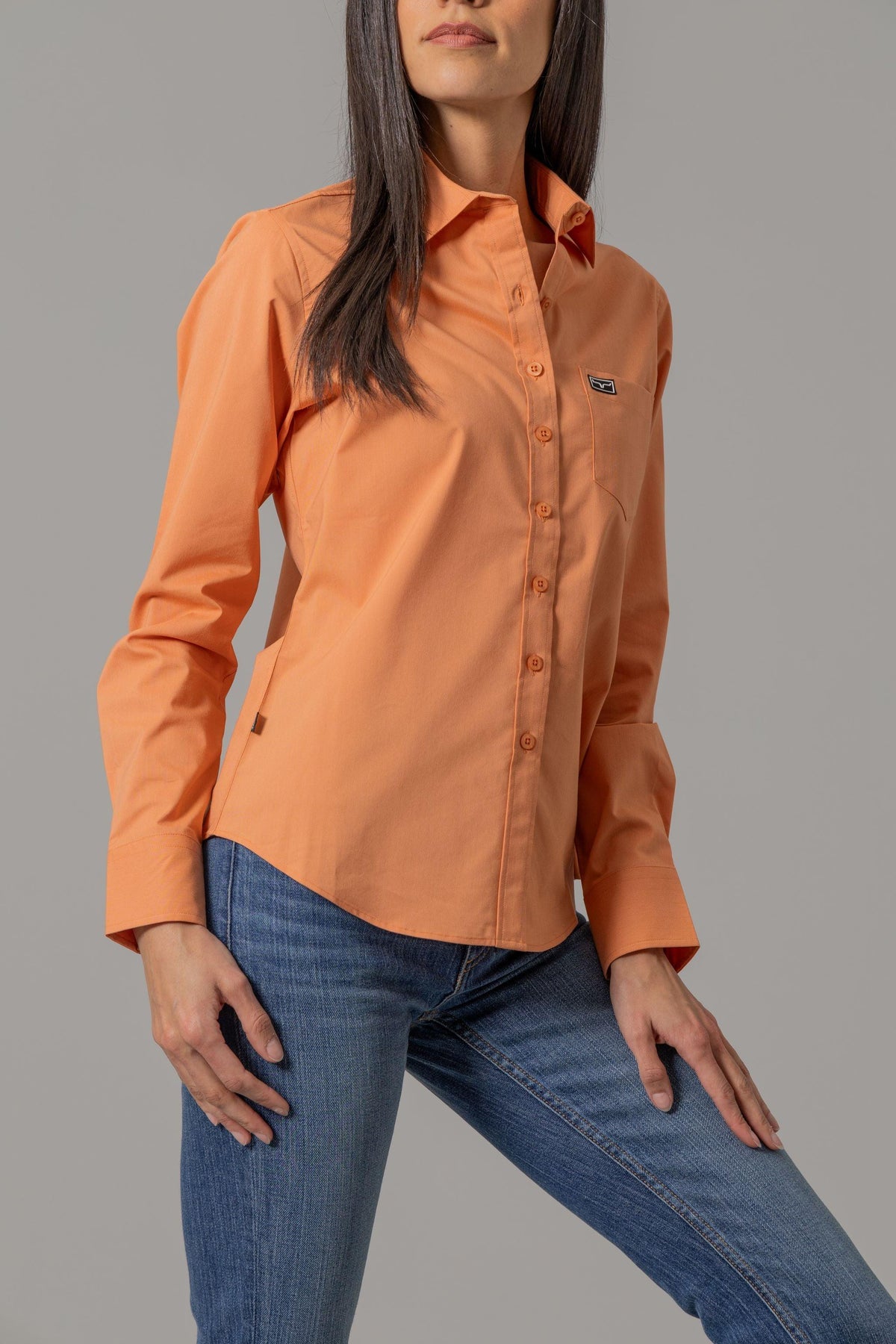 Kimes Ranch Ladies Linville top in Melon with long sleeves and a chest pocket with the Kimes Ranch logo