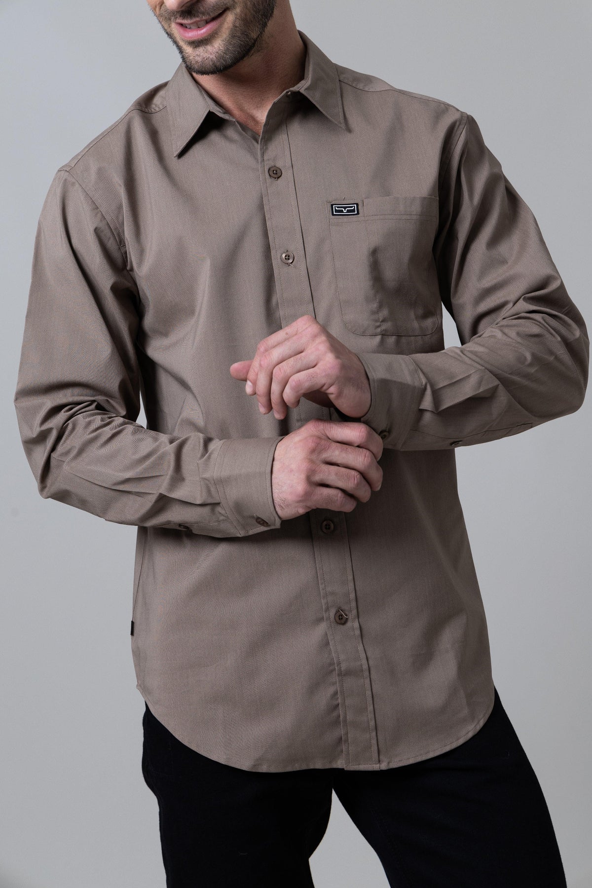 Kimes Ranch Linville Long Sleeve Dress Shirt in Taupe with a button front and a chest pocket with the Kimes Ranch logo