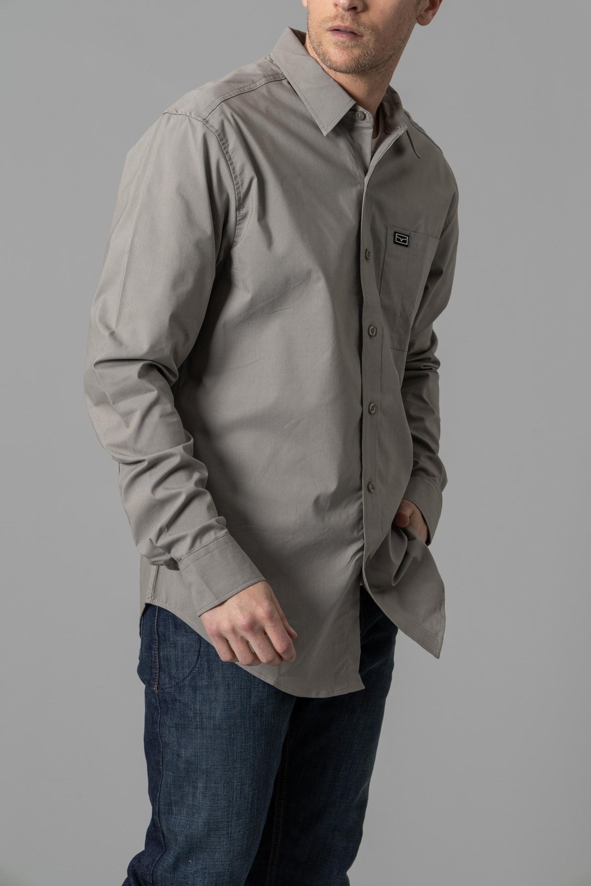 Kimes Ranch Linville Long Sleeve Dress Shirt in Sage, side view, with a button front and chest pocket with logo