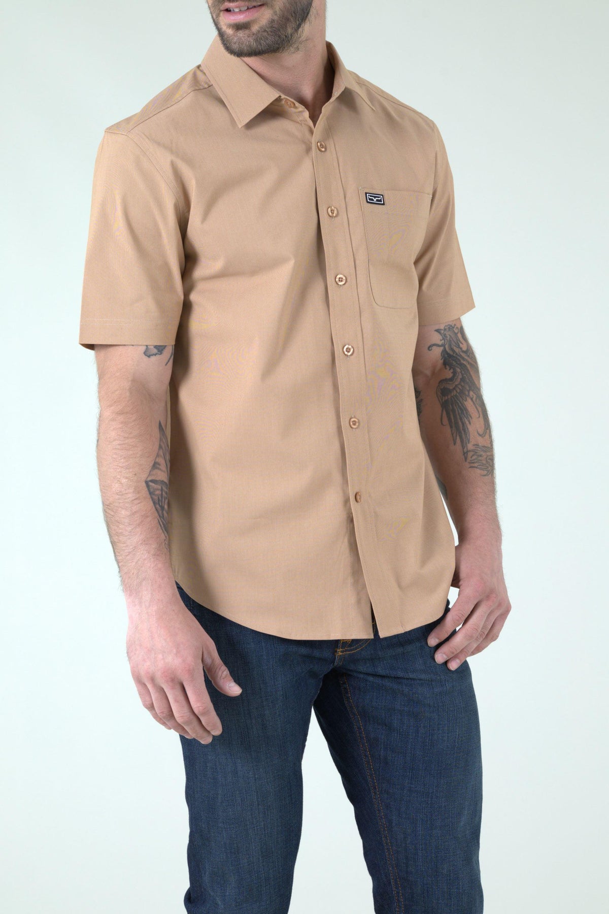 Kimes Ranch Linville Short Sleeve Dress Shirt in Desert Brown with a chest pocket and logo patch