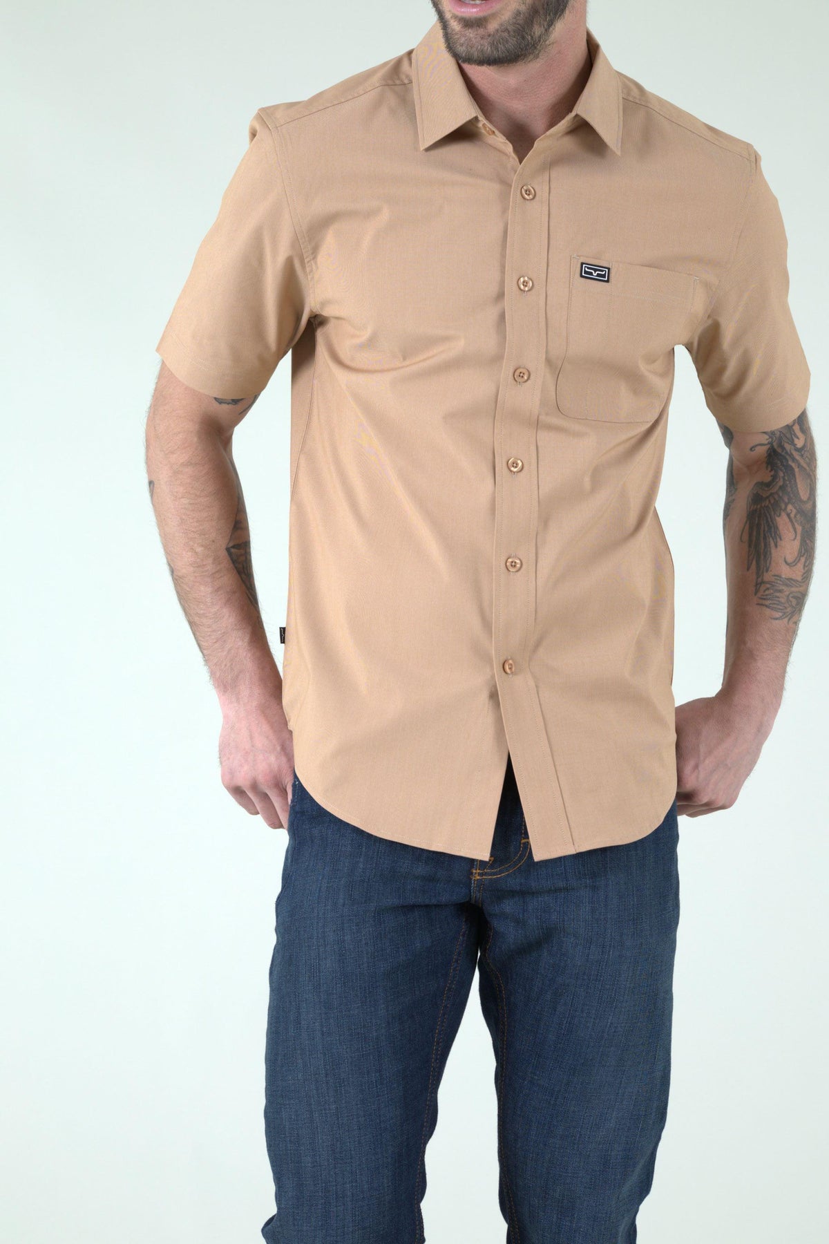 Kimes Ranch Linville Short Sleeve Dress Shirt in Desert Brown with a chest pocket and logo patch