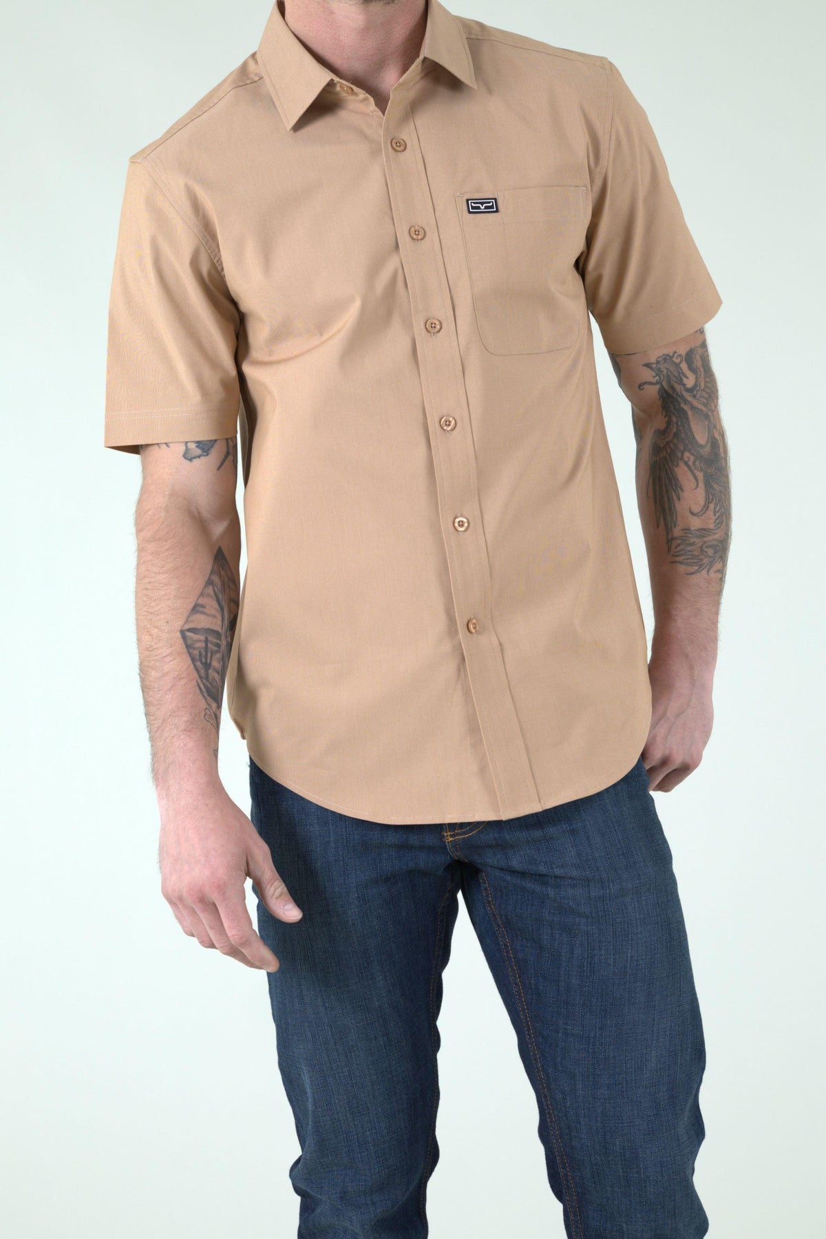 Kimes Ranch Linville Short Sleeve Dress Shirt in Desert Brown with a chest pocket and logo patch