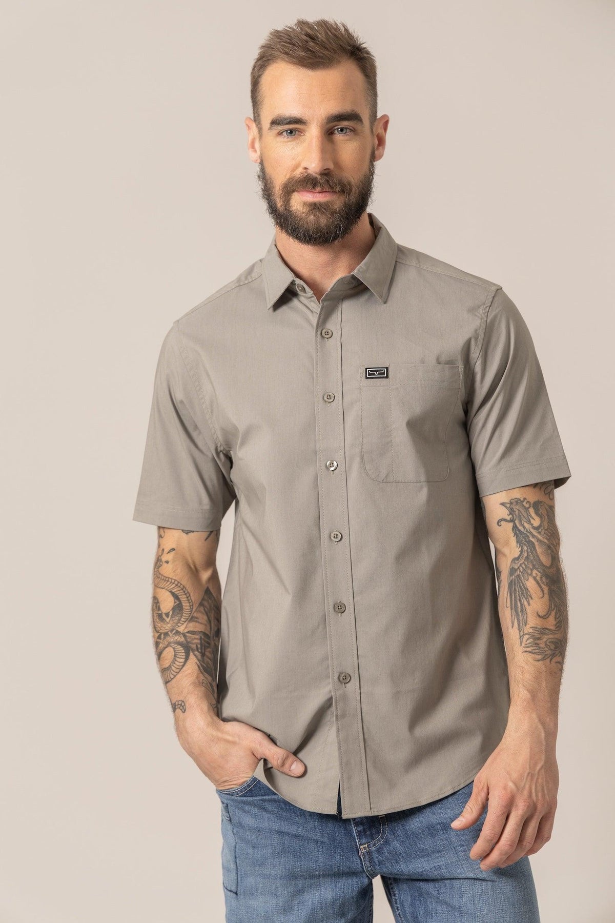 Kimes Ranch Linville Short Sleeve Dress Shirt in Sage with a button front and a chest pocket with the Kimes Ranch logo